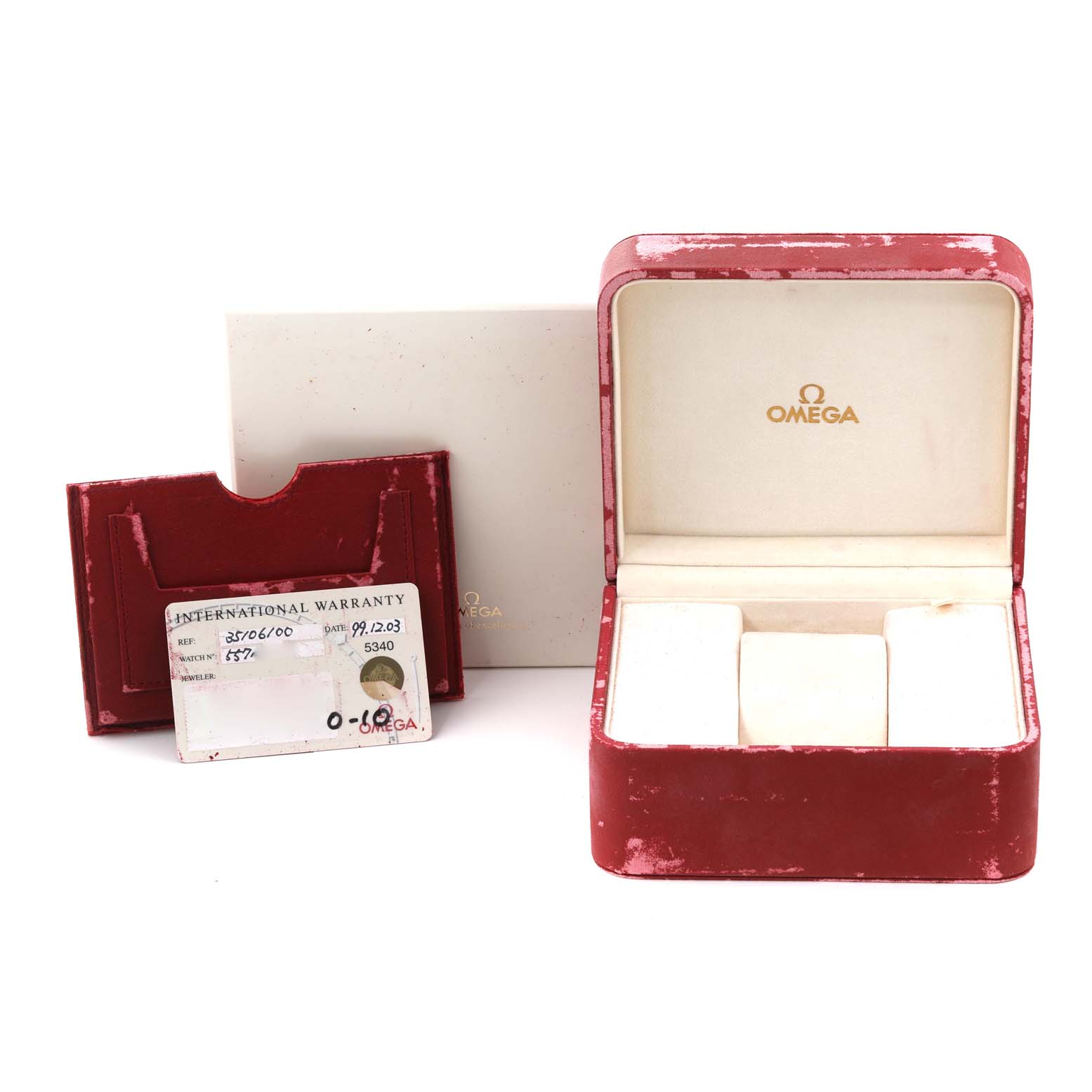 The image shows the packaging, warranty card, and accessories for an Omega Speedmaster 3510.61.00 Men
s Stainless Steel Red Dial 3510.61.00 Men
s Stainless Steel Red Dial watch from a front angle.