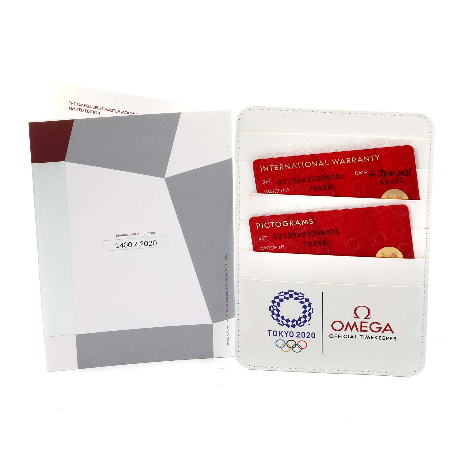 The image shows the warranty cards and documentation for the Omega Speedmaster 522.30.42.30.06.001 Men's Stainless Steel Silver Dial 522.30.42.30.06.001 Men's Stainless Steel Silver Dial watch model, including international warranty and pictogram cards.