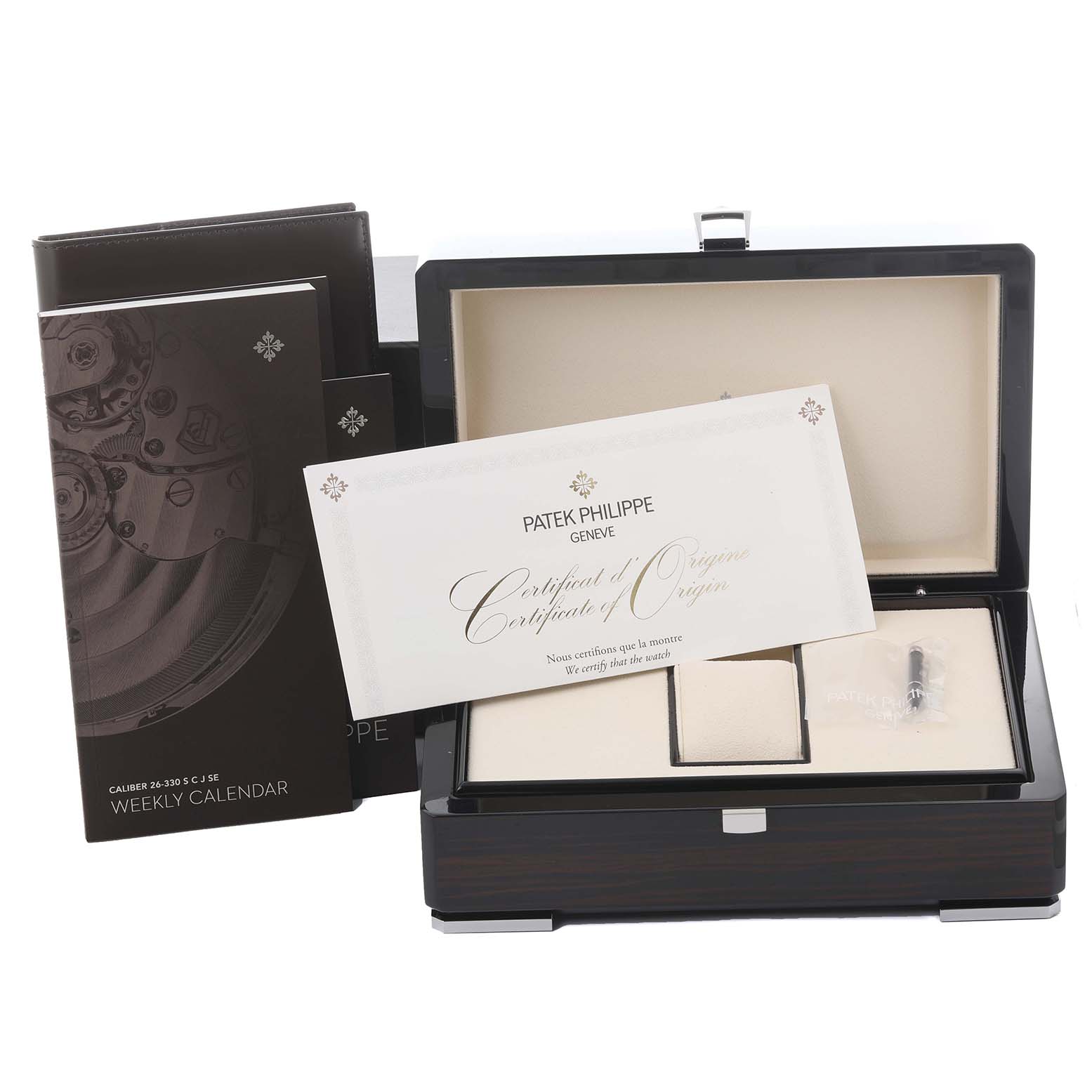 The image shows the packaging, box, and documents for a Patek Philippe Complications 5212A-001 Men's Stainless Steel Silver Dial 5212A-001 Men's Stainless Steel Silver Dial watch, viewed from the front.