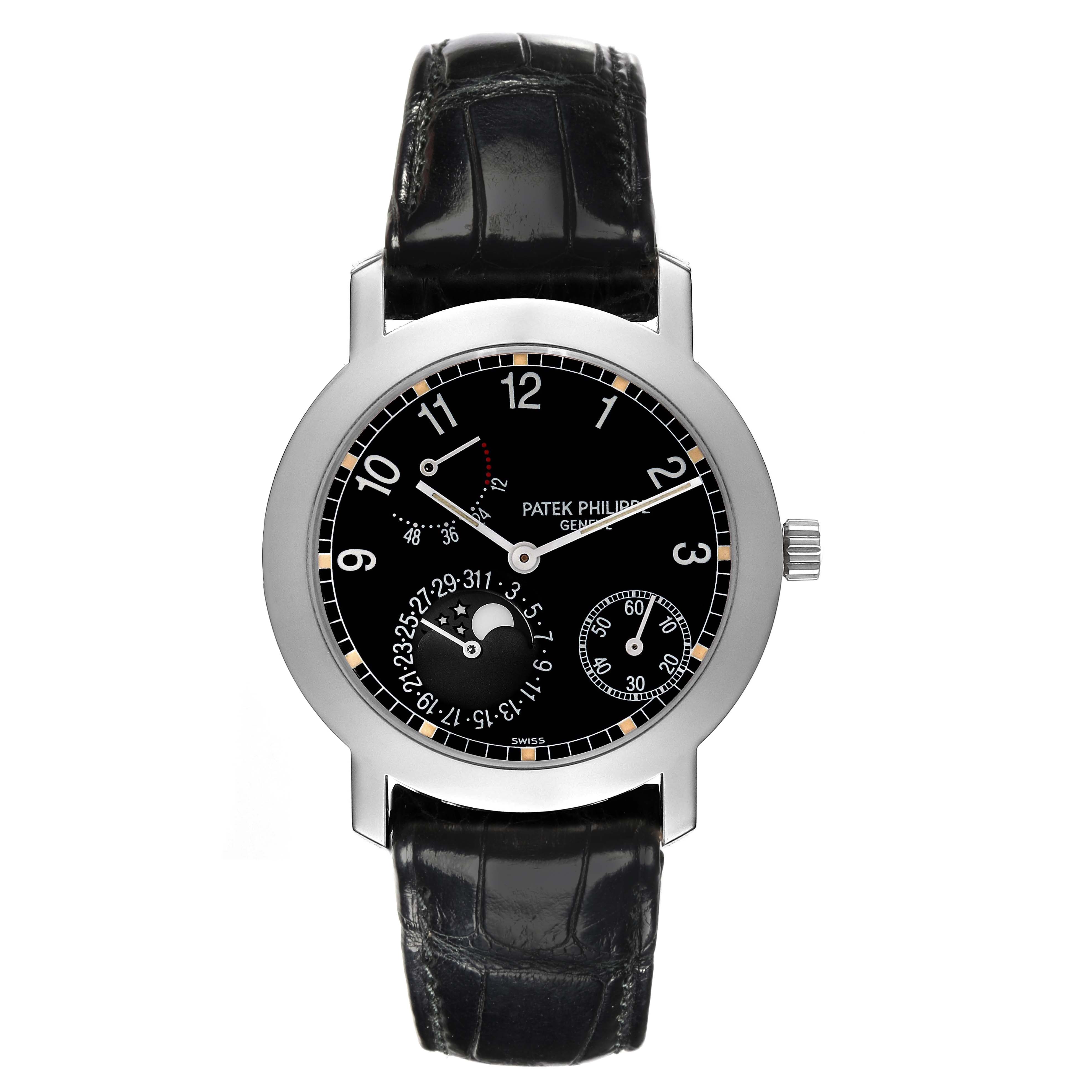 The watch is a Patek Philippe Complications 5055G-001 Men's White Gold Black Dial 5055G-001 Men's White Gold Black Dial model shown from a top view, displaying the dial, case, and leather strap.