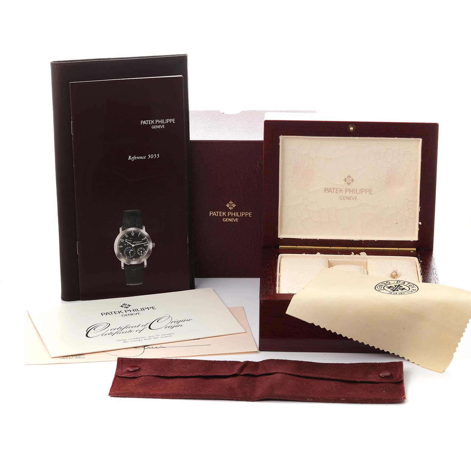 The image shows the Patek Philippe Complications 5055G-001 Men's White Gold Black Dial 5055G-001 Men's White Gold Black Dial model box, booklet, certificate, and cleaning cloth, viewed from the front.
