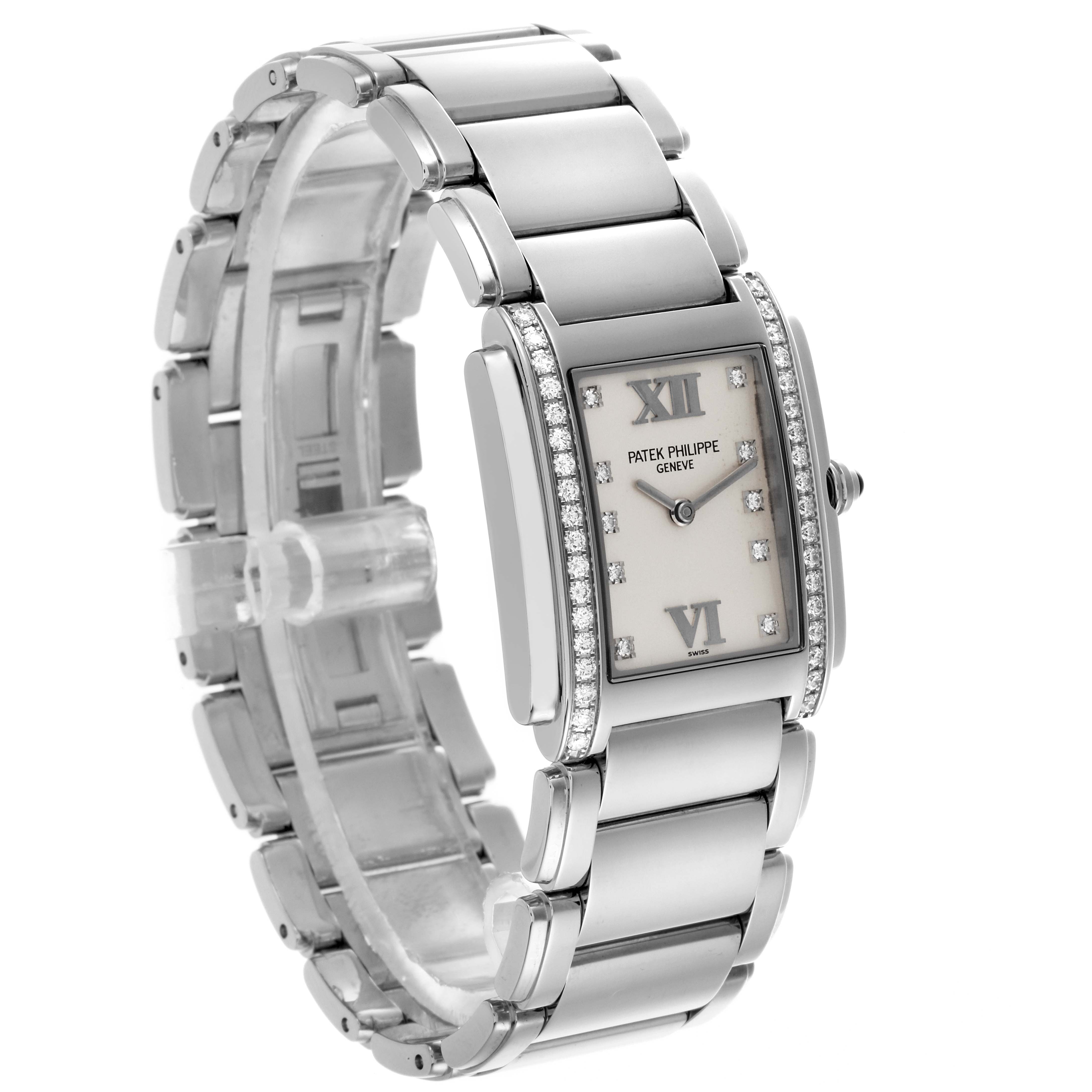 The Patek Philippe Twenty-4 4910/10A-011 Women's Stainless Steel Silver Dial 4910/10A-011 Women's Stainless Steel Silver Dial watch is shown from a three-quarter angle, highlighting its face, bezel, and bracelet.