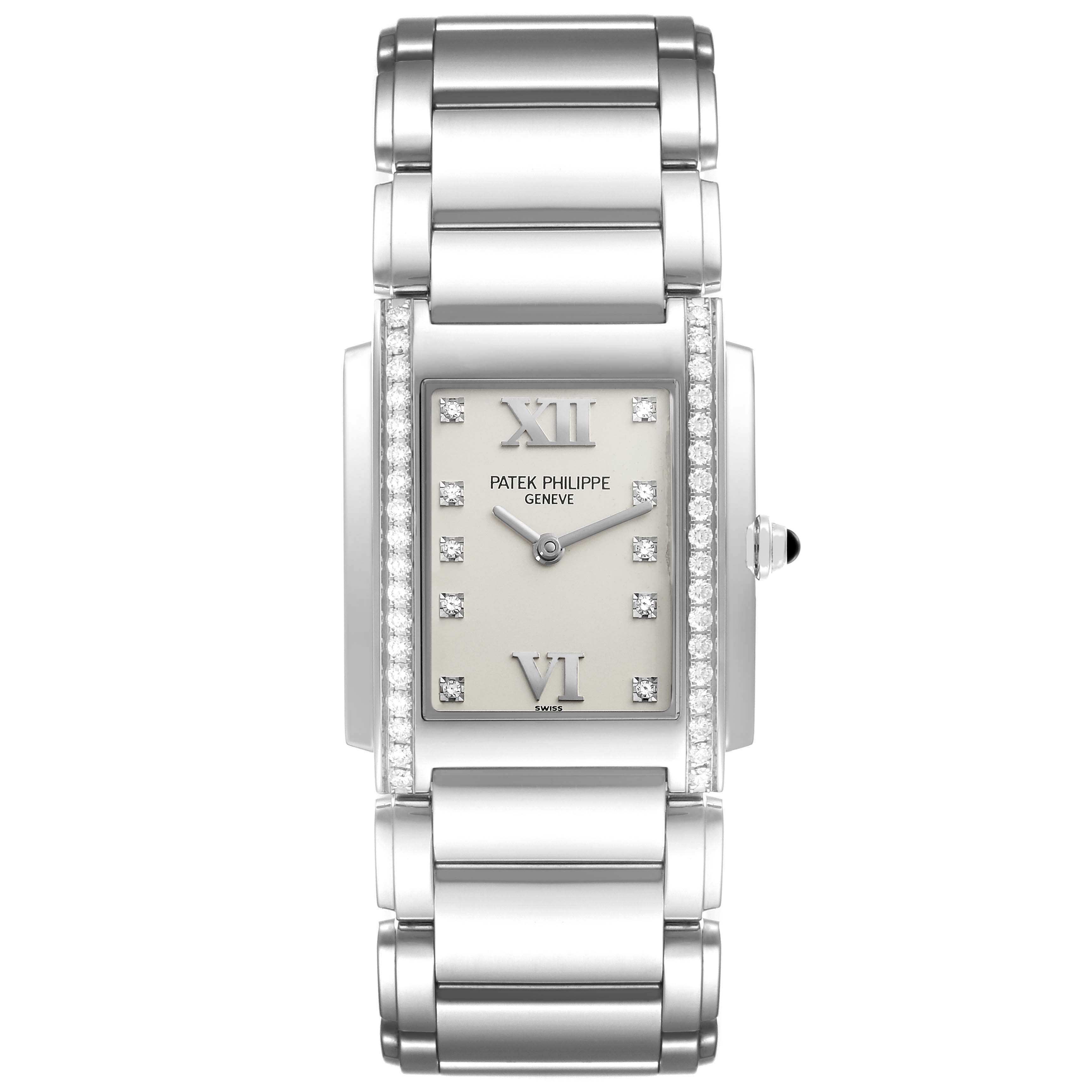 The image shows a front view of the Patek Philippe Twenty-4 4910/10A-011 Women's Stainless Steel Silver Dial 4910/10A-011 Women's Stainless Steel Silver Dial watch, highlighting its bracelet and diamond-studded bezel.
