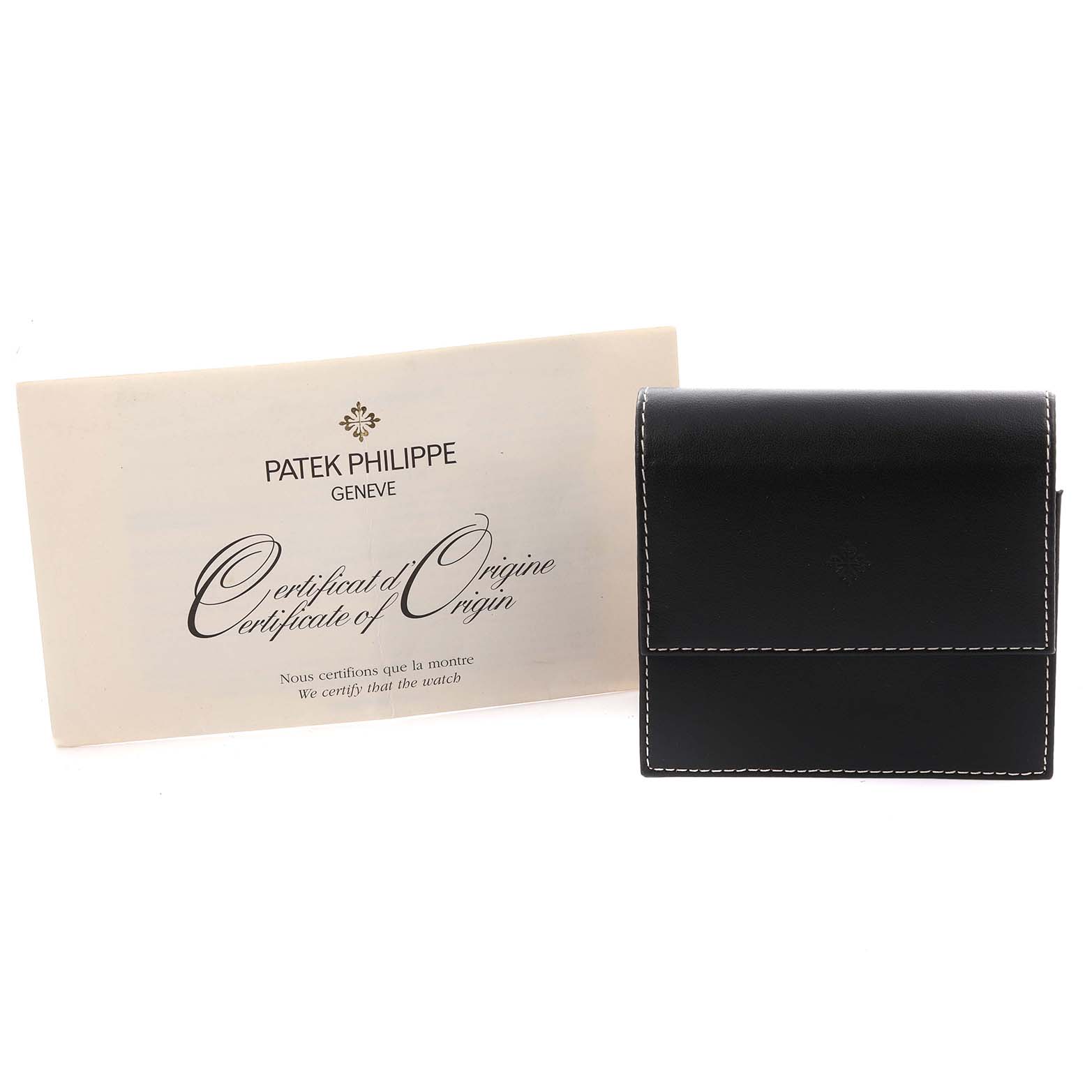 This image shows a Patek Philippe Twenty-4 4910/10A-011 Women's Stainless Steel Silver Dial 4910/10A-011 Women's Stainless Steel Silver Dial model certificate and a black watch case from the front.