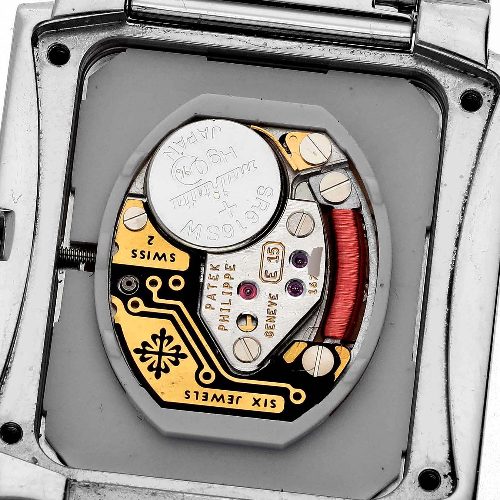 The image shows the back view of a Patek Philippe Twenty-4 4910/10A-011 Women's Stainless Steel Silver Dial 4910/10A-011 Women's Stainless Steel Silver Dial watch, highlighting its internal movement components.