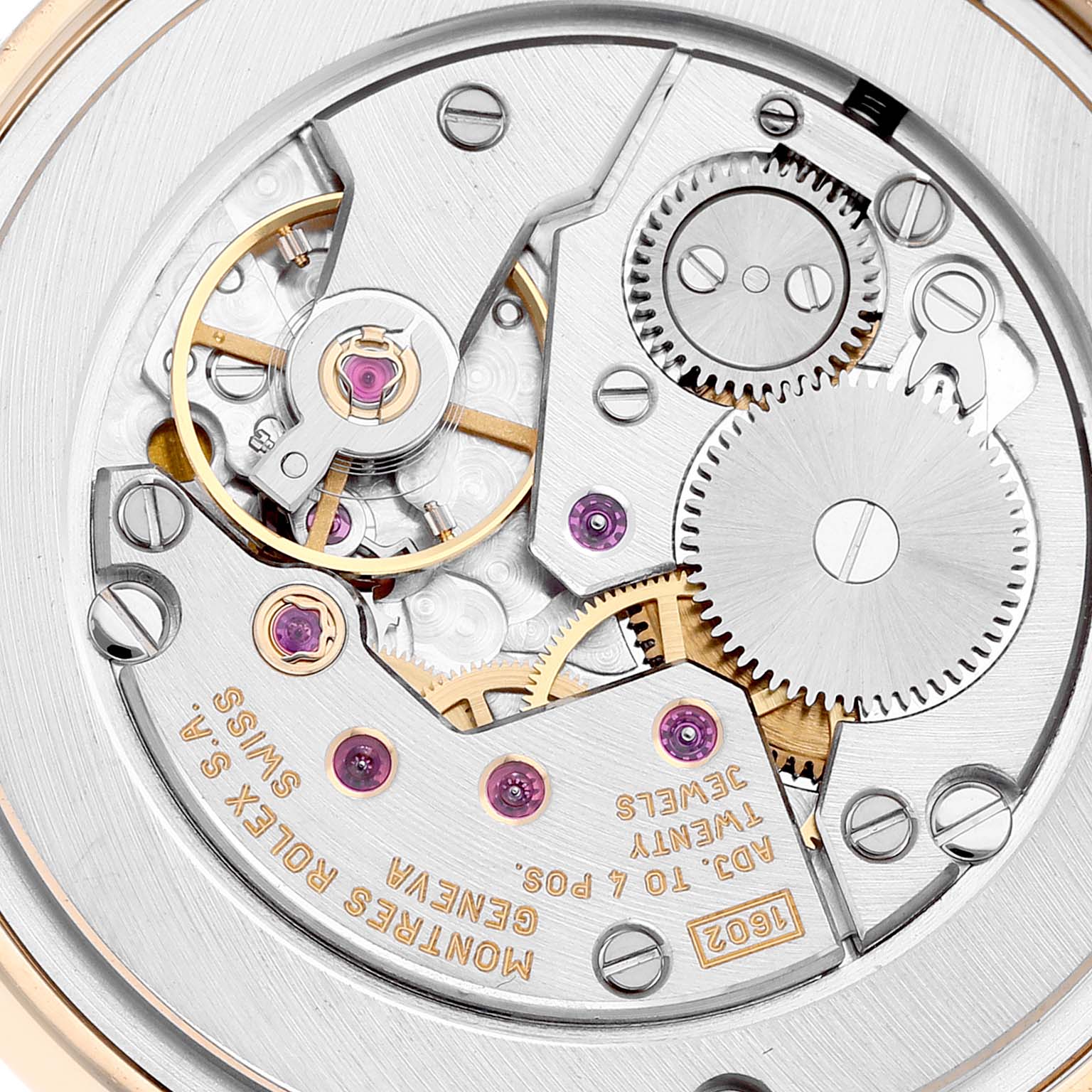 This image shows the intricate movement parts of a Rolex Cellini 5116 Men's Yellow Gold Black Dial 5116 Men's Yellow Gold Black Dial watch from a close-up, showcasing gears and jewels.