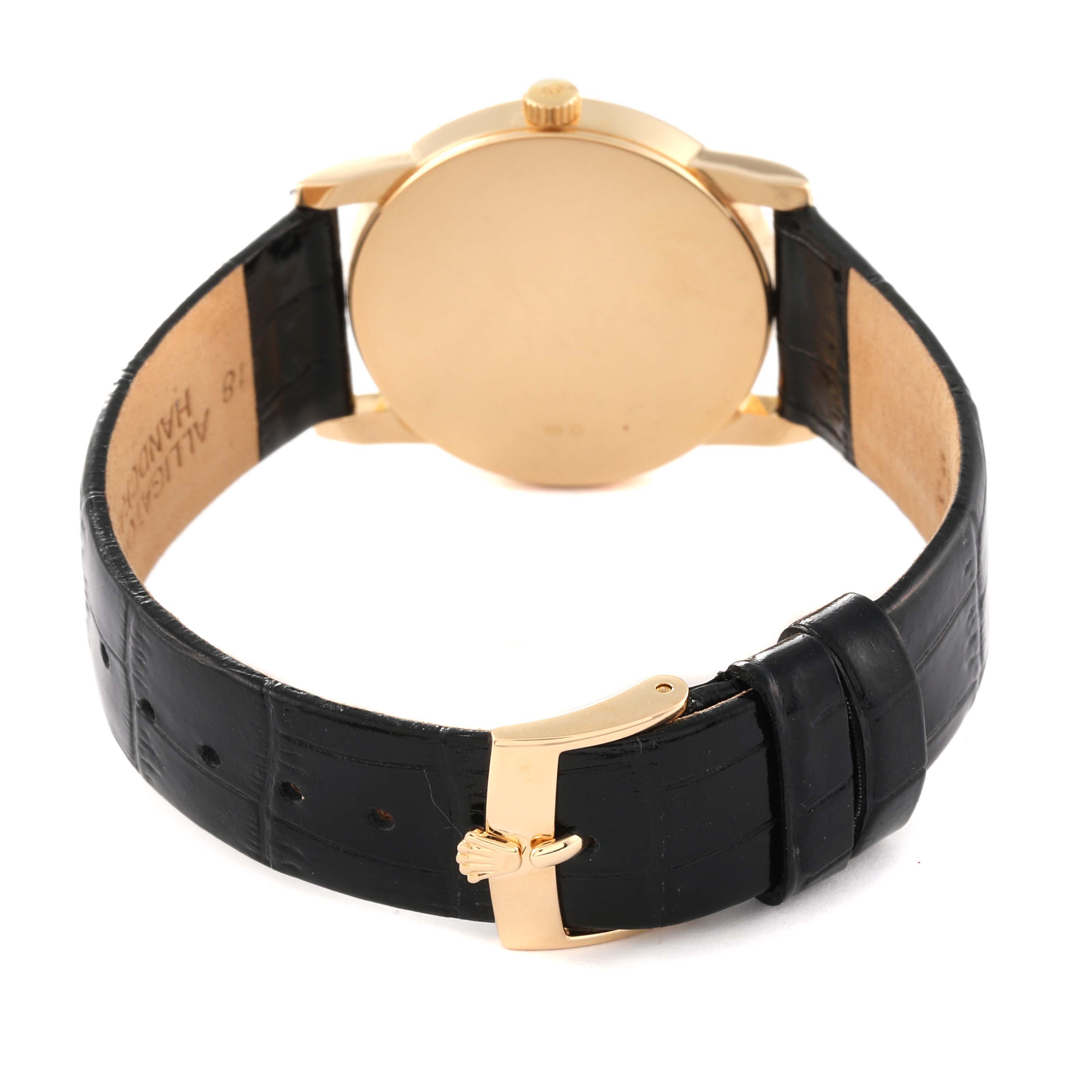 This image shows the back of a Rolex Cellini 5116 Men's Yellow Gold Black Dial 5116 Men's Yellow Gold Black Dial watch, highlighting the case back, crown, and black leather strap with the buckle.