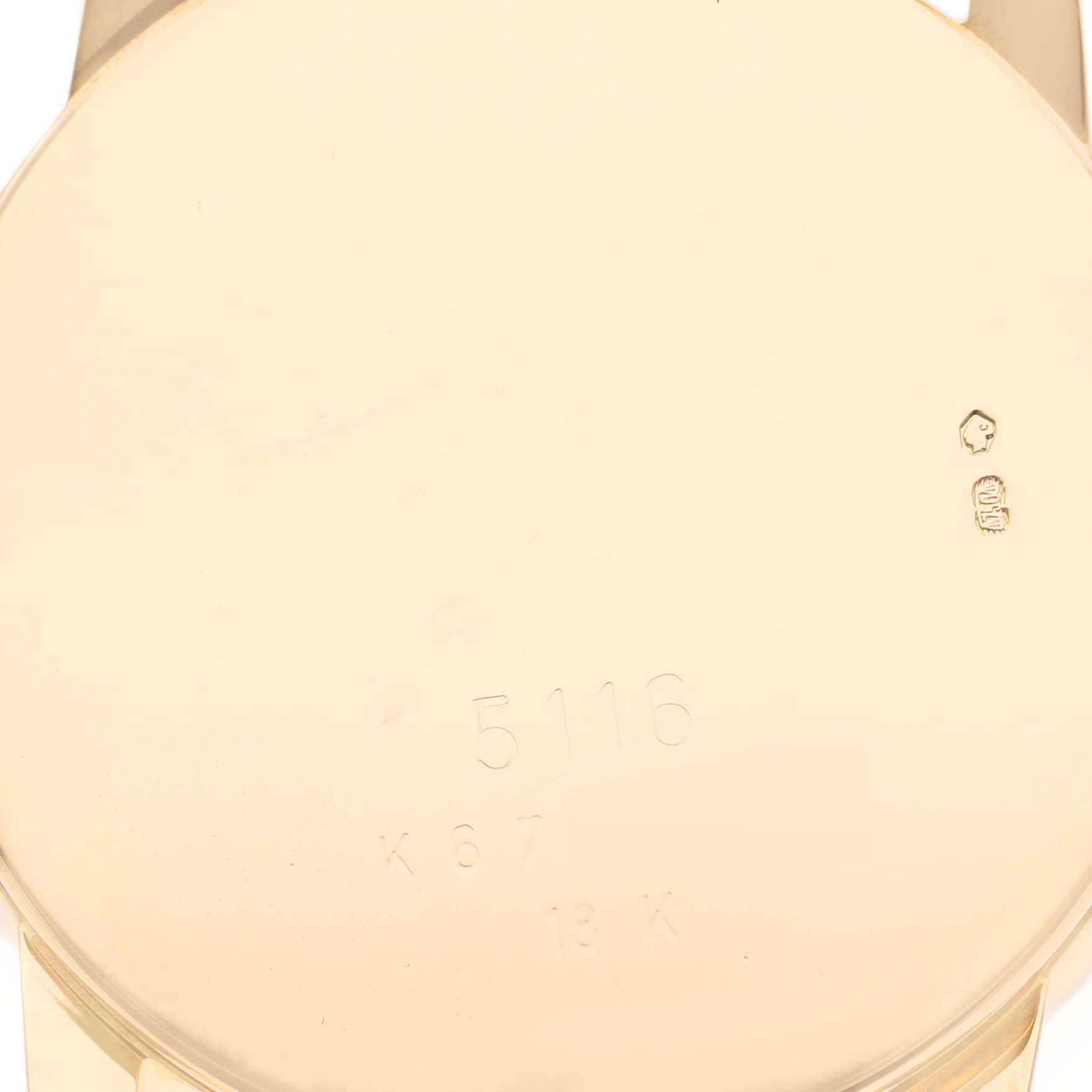 The image shows the back case of a Rolex Cellini 5116 Men's Yellow Gold Black Dial 5116 Men's Yellow Gold Black Dial model, featuring hallmark stamps and the model number.