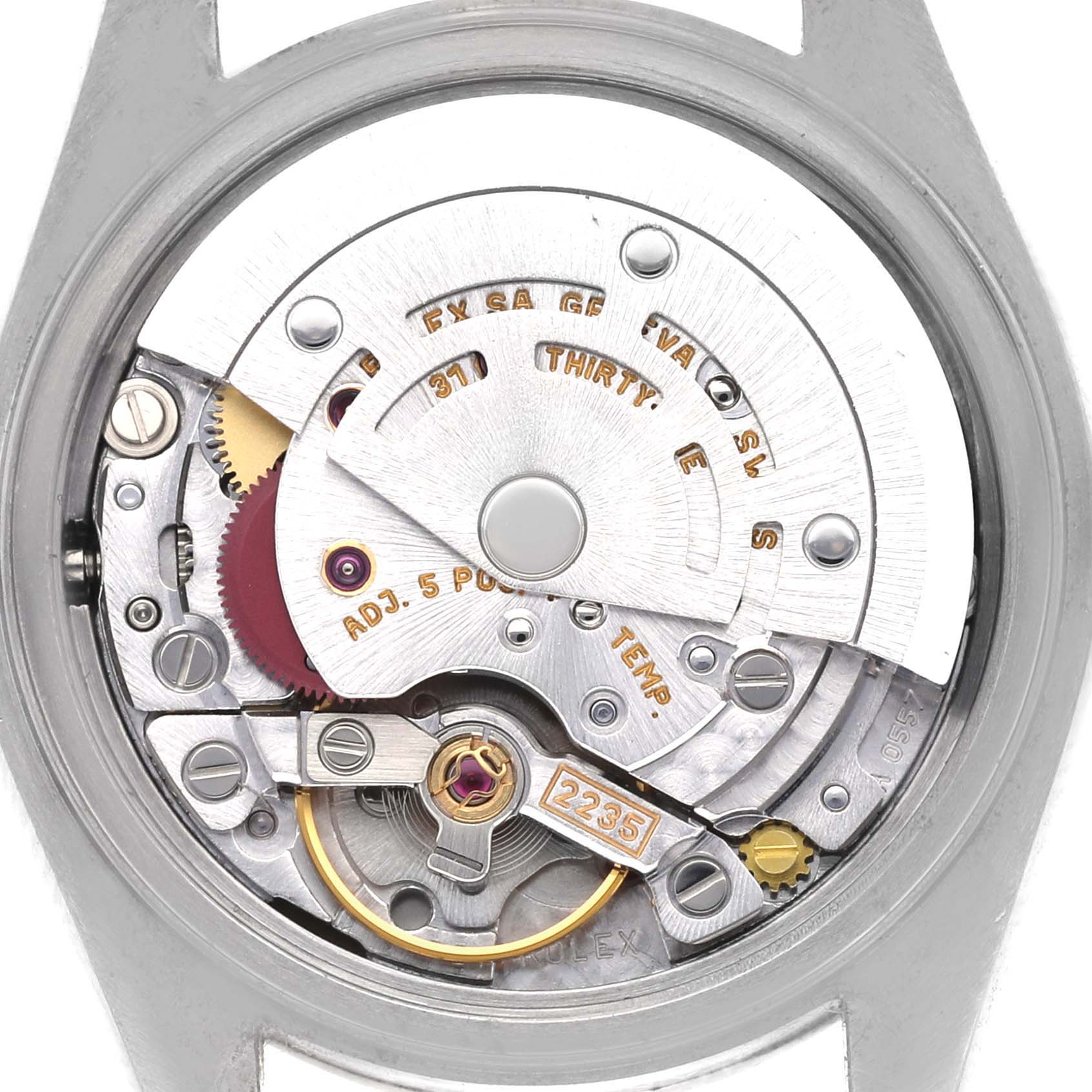 The image shows the movement mechanism of a Rolex Date 79160 Women's Stainless Steel Pink Dial 79160 Women's Stainless Steel Pink Dial watch from a back angle, highlighting gears and components.