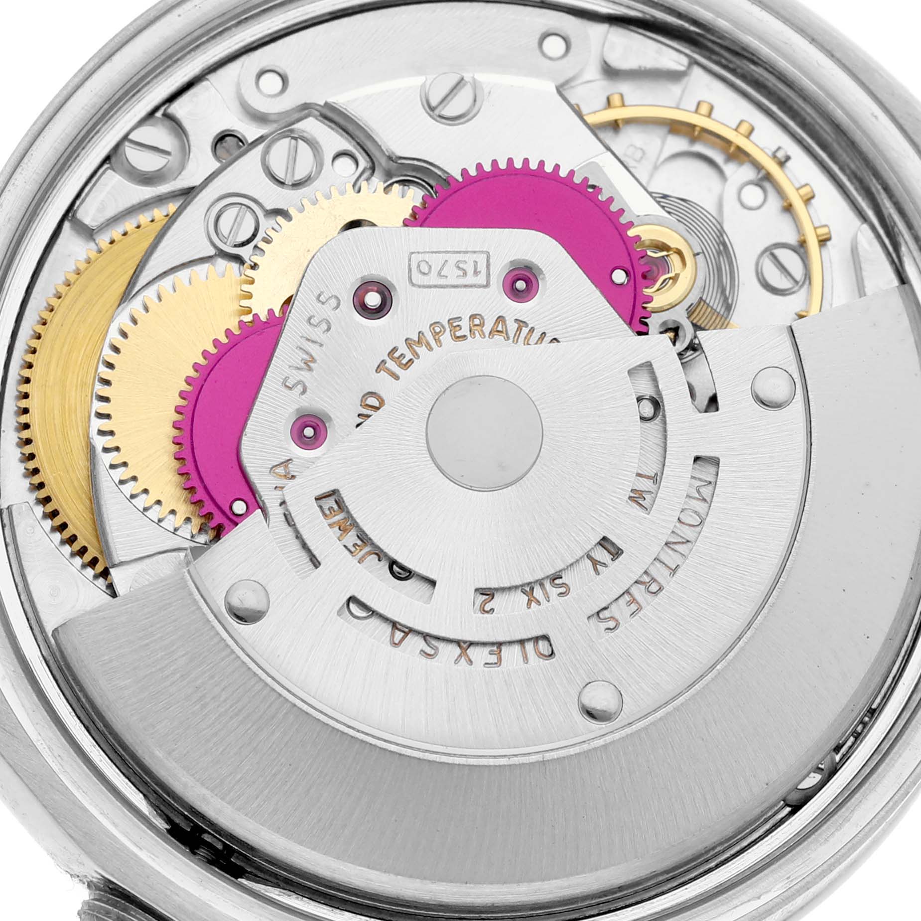 This image shows a close-up of the movement mechanism inside a Vintage Collection model by Rolex, highlighting gears and components.
