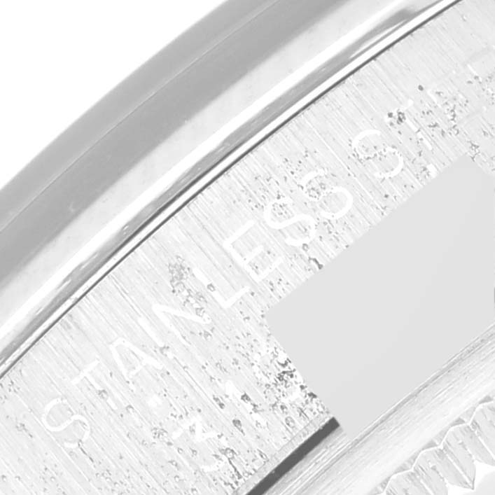 This image shows a close-up of the side of a Rolex Vintage Collection 1500 Men's Stainless Steel Grey Dial 1500 Men's Stainless Steel Grey Dial watch, highlighting the "STAINLESS" engraving.