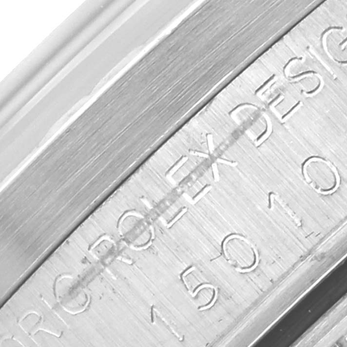 The image shows a close-up of the case side engraving on a Rolex Date 15010 Men's Stainless Steel Silver Dial 15010 Men's Stainless Steel Silver Dial model, highlighting the serial number and design text.
