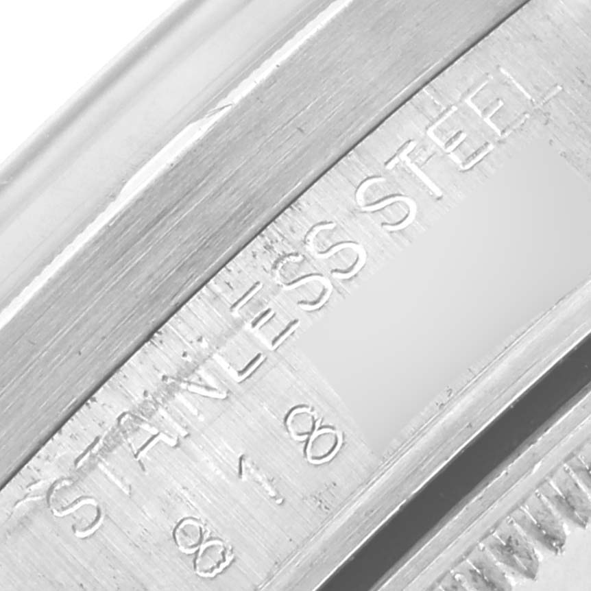 The image shows a close-up of the inner bezel or rehaut of a Rolex Date 15010 Men's Stainless Steel Silver Dial 15010 Men's Stainless Steel Silver Dial watch, highlighting "STAINLESS STEEL" engraving.