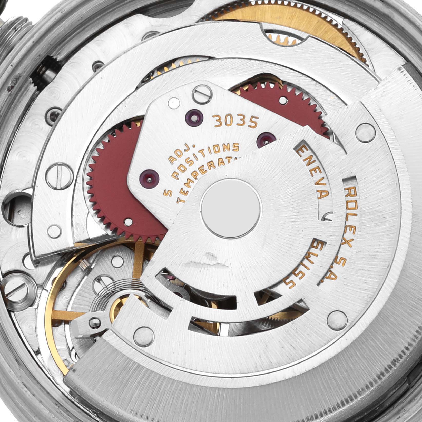 This image shows an internal view of the Rolex Date 15010 Men's Stainless Steel Silver Dial 15010 Men's Stainless Steel Silver Dial model, highlighting gears and components of its movement mechanism.