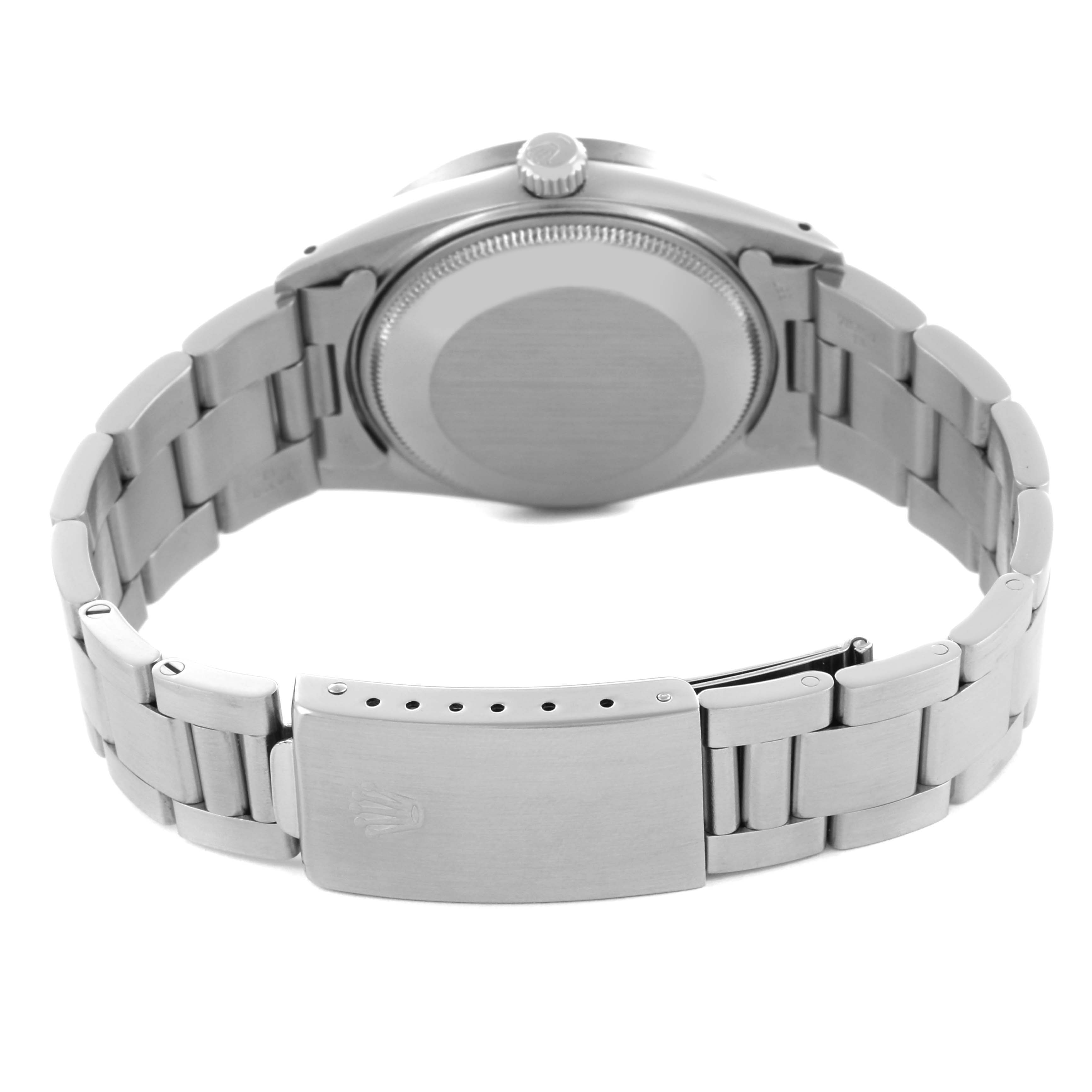 The image shows the back and clasp of a Rolex Date 15010 Men's Stainless Steel Silver Dial 15010 Men's Stainless Steel Silver Dial model watch, highlighting the bracelet and caseback.