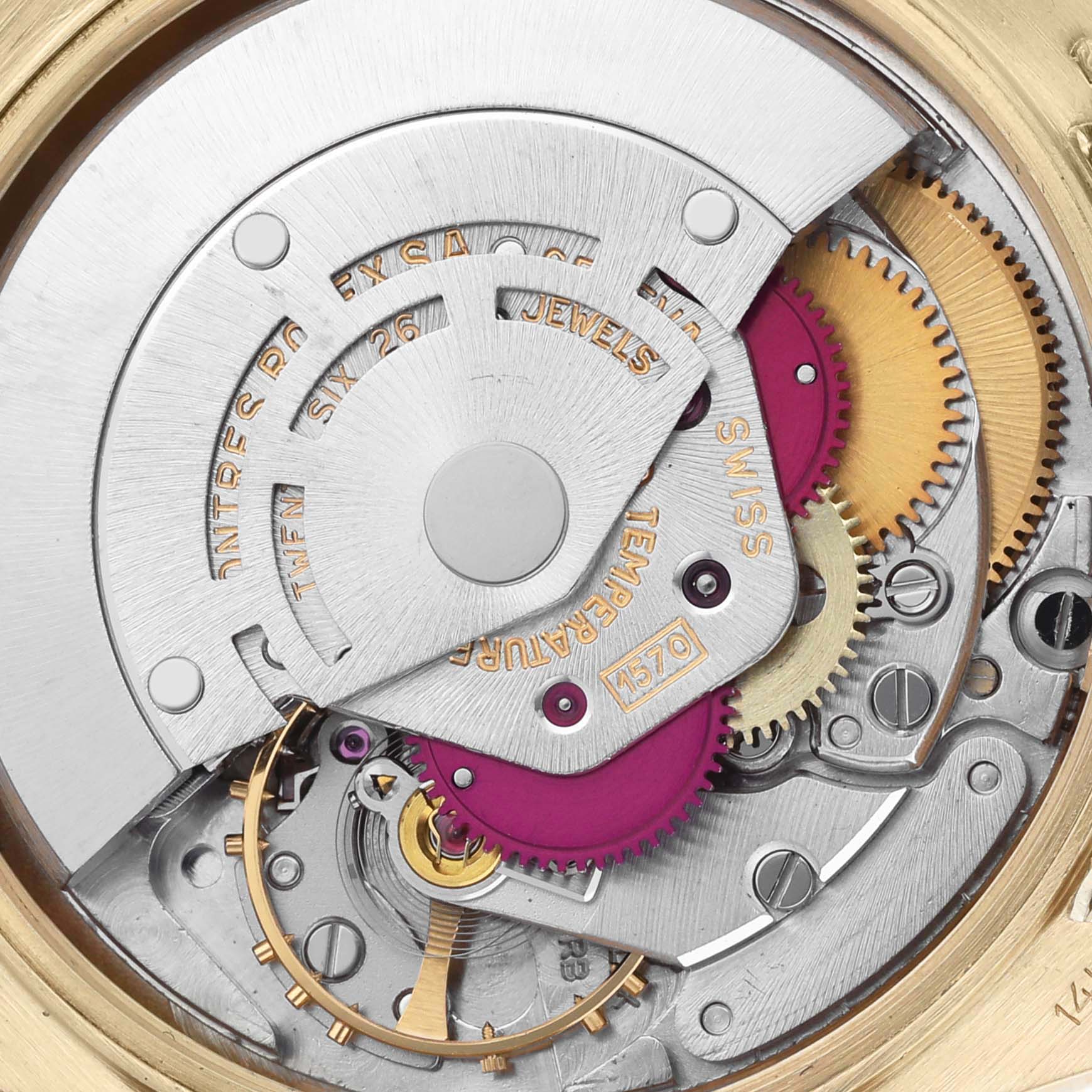 The image shows a close-up view of the Rolex Date model watch movement with visible gears and components.