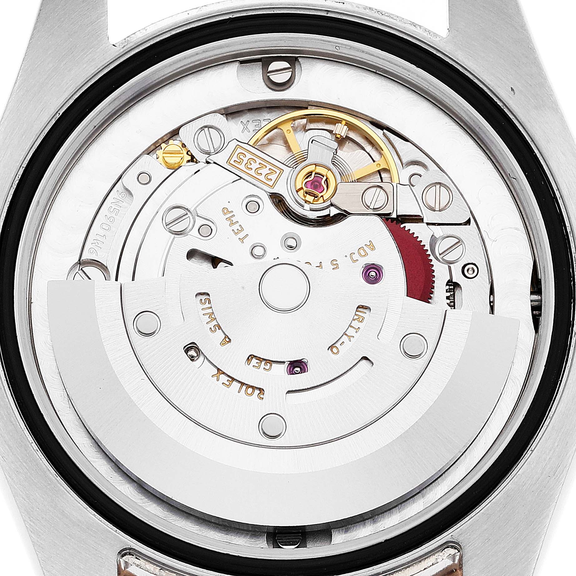 The image shows an inside view of the movement mechanism of a Mid-Size Rolex watch.