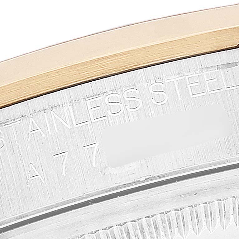 This close-up image shows the edge and engraved details of the Rolex Datejust 16203 Men's Steel and Gold (two tone) Champagne Dial 16203 Men's Steel and Gold (two tone) Champagne Dial watch case.