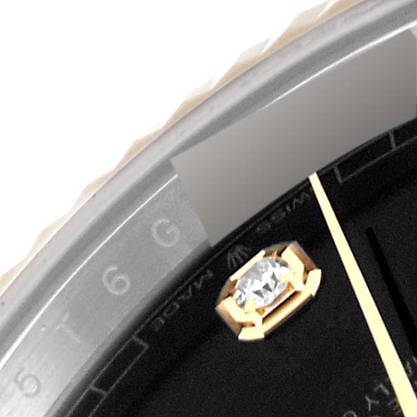 This close-up shows part of the dial, bezel, and marker of the Rolex Datejust 41 126333 Men's Steel and Gold (two tone) Black Dial 126333 Men's Steel and Gold (two tone) Black Dial watch.