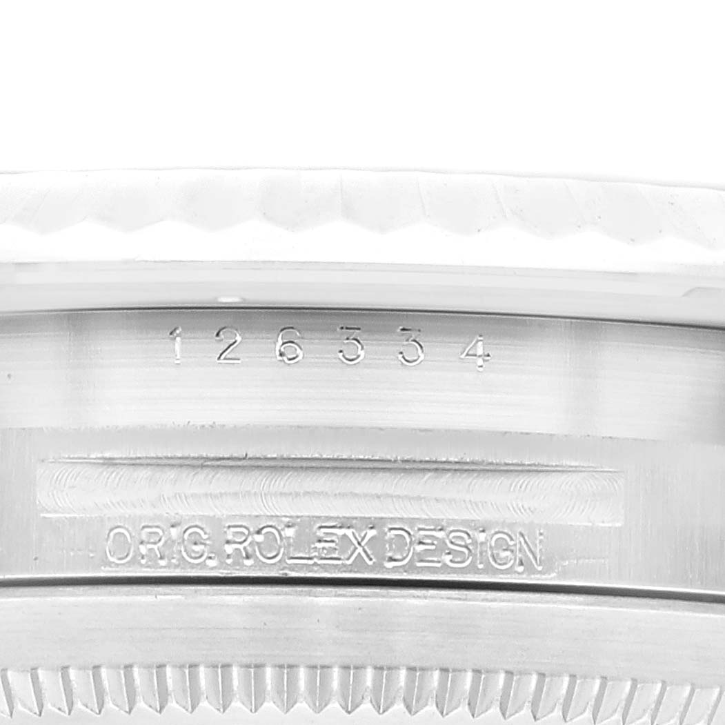 This image shows the side of a Rolex Datejust 41 126334 Men's Stainless Steel Blue Dial 126334 Men's Stainless Steel Blue Dial model case with the model number and "O.R.G. ROLEX DESIGN" engraving.