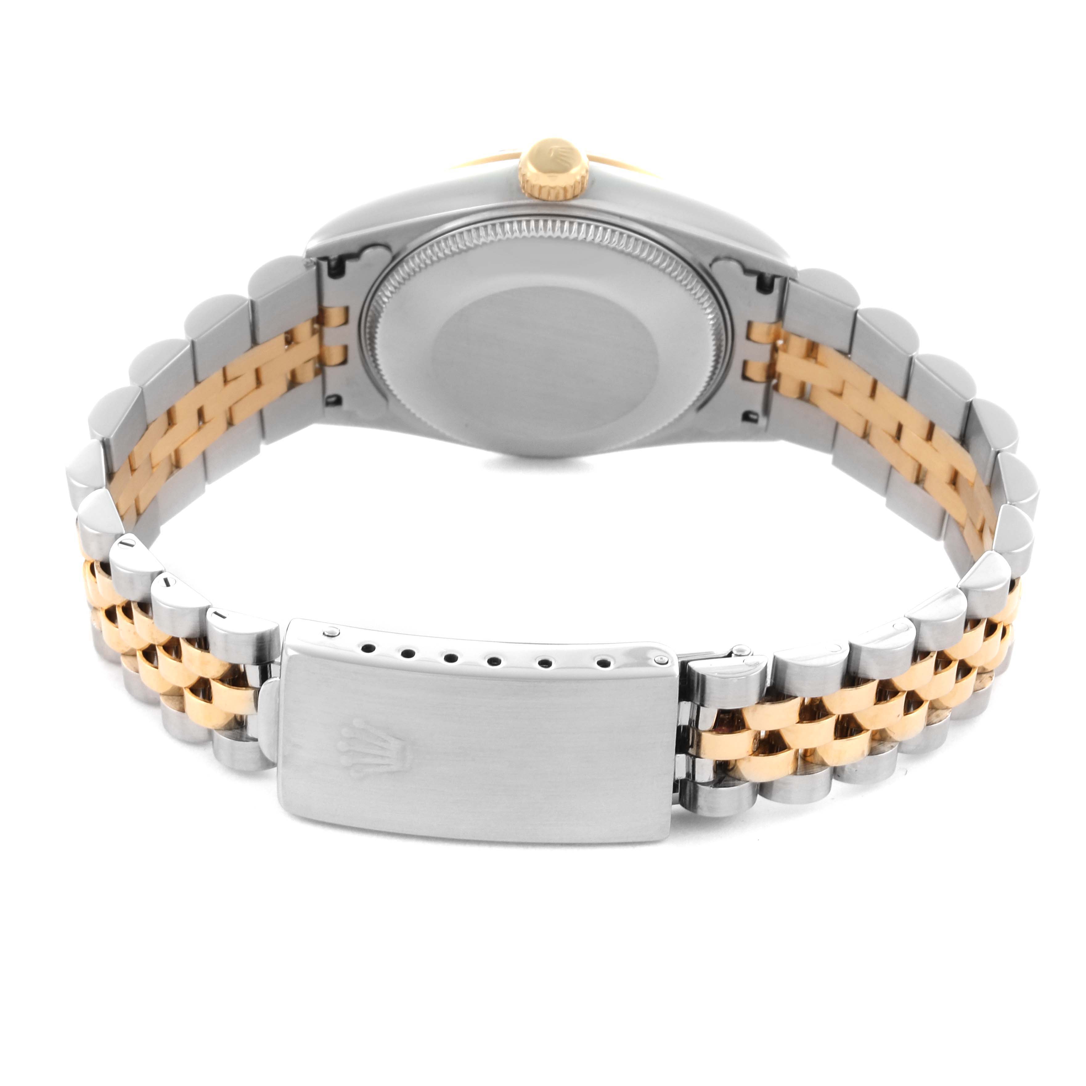 The image shows the back of the Mid-Size Rolex watch, displaying its clasp and bracelet.