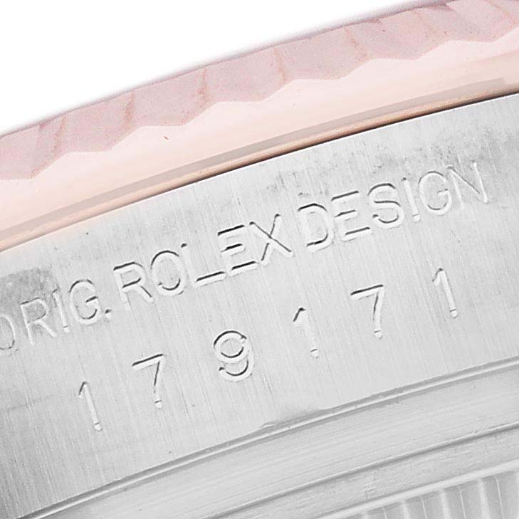 The image shows a close-up of the Rolex Datejust 179171NR Women's Steel and Gold (two tone) Mother of Pearl Dial 179171NR Women's Steel and Gold (two tone) Mother of Pearl Dial's edge and engraved serial number on the case.