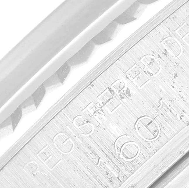 This image shows a close-up angle of the engraved inner bezel and case side of a Vintage Collection model by Rolex.