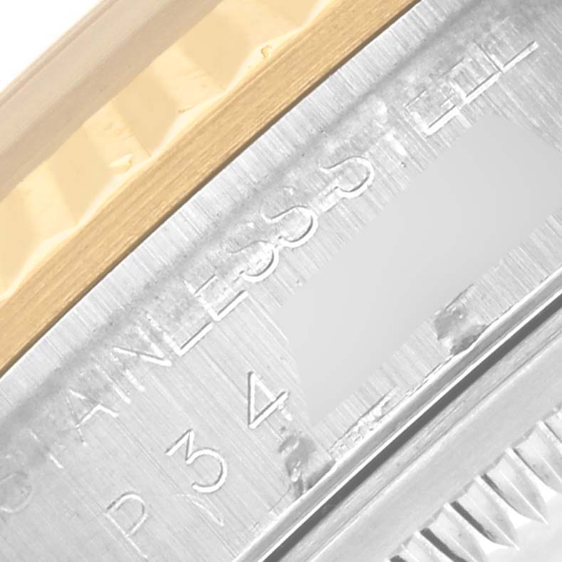 The image shows a close-up of the stainless steel and gold edge on a Rolex Datejust 16233 Men's Steel and Gold (two tone) Champagne Dial 16233 Men's Steel and Gold (two tone) Champagne Dial watch, highlighting engravings.