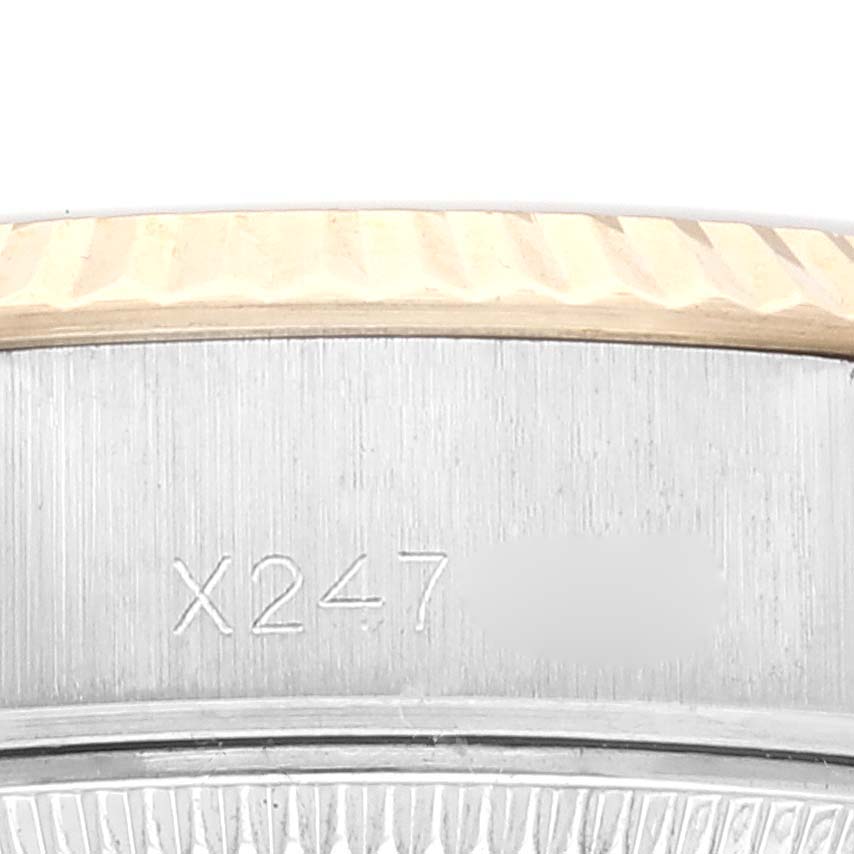 The image shows a close-up of the side of a Rolex Datejust 69173 Women's Steel and Gold (two tone) Champagne Dial 69173 Women's Steel and Gold (two tone) Champagne Dial watch, highlighting the model number and part of the fluted bezel.