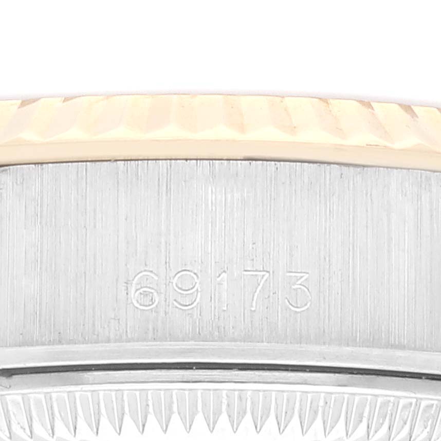 This image shows a close-up of the side of the bezel and the case of a Rolex Datejust 69173 Women's Steel and Gold (two tone) Champagne Dial 69173 Women's Steel and Gold (two tone) Champagne Dial watch, with the model number 69173 visible.
