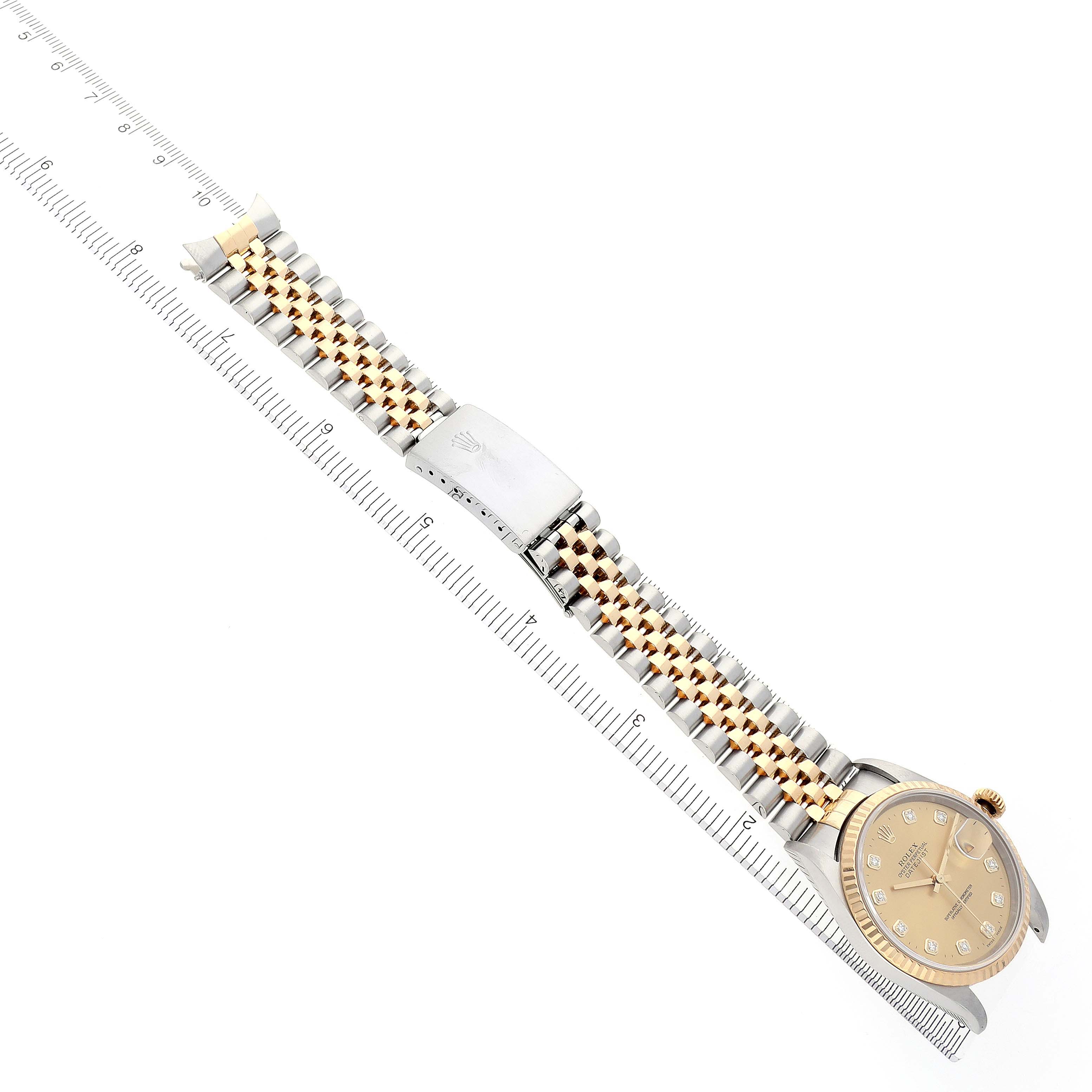 The Rolex Datejust 16233 Men's Steel and Gold (two tone) Champagne Dial 16233 Men's Steel and Gold (two tone) Champagne Dial watch is shown from a top-down angle, featuring its bracelet, clasp, and face.