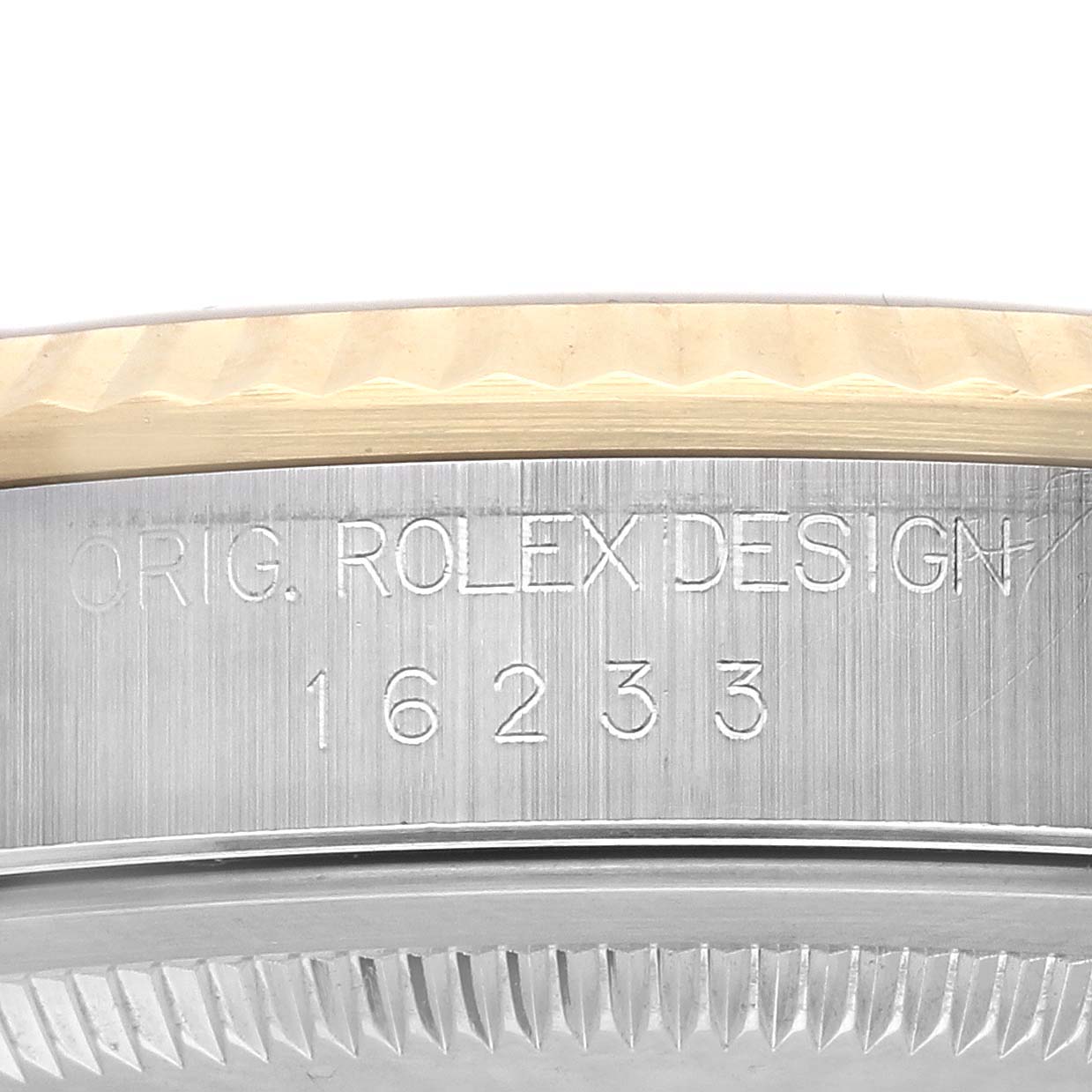 This image shows the side engraving on a Rolex Datejust 16233 Men's Steel and Gold (two tone) Champagne Dial 16233 Men's Steel and Gold (two tone) Champagne Dial, highlighting the model number 16233.