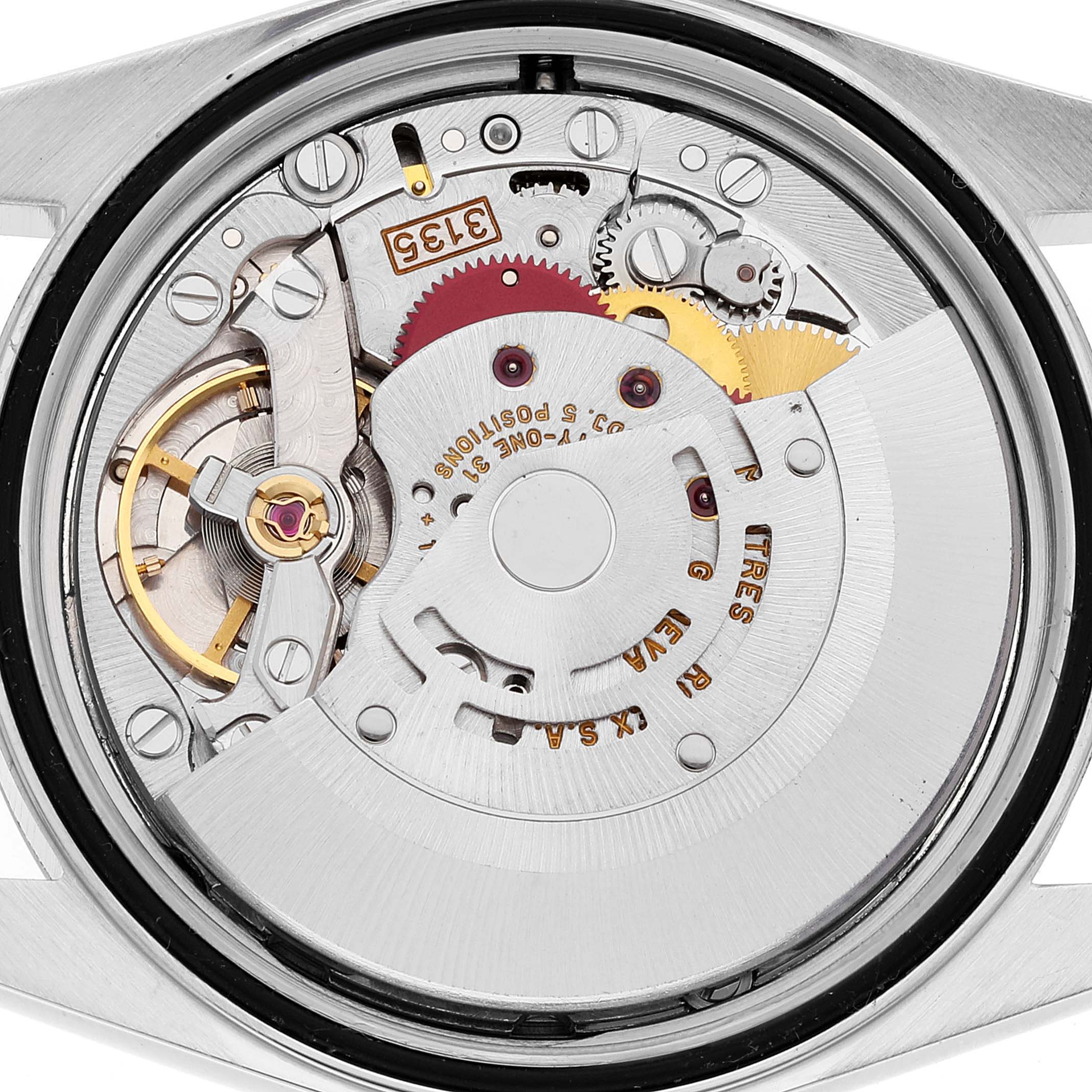 The image shows a close-up of the Rolex Datejust 16233 Men's Steel and Gold (two tone) Beige Dial 16233 Men's Steel and Gold (two tone) Beige Dial watch movement from the back, displaying the intricate internal mechanism.
