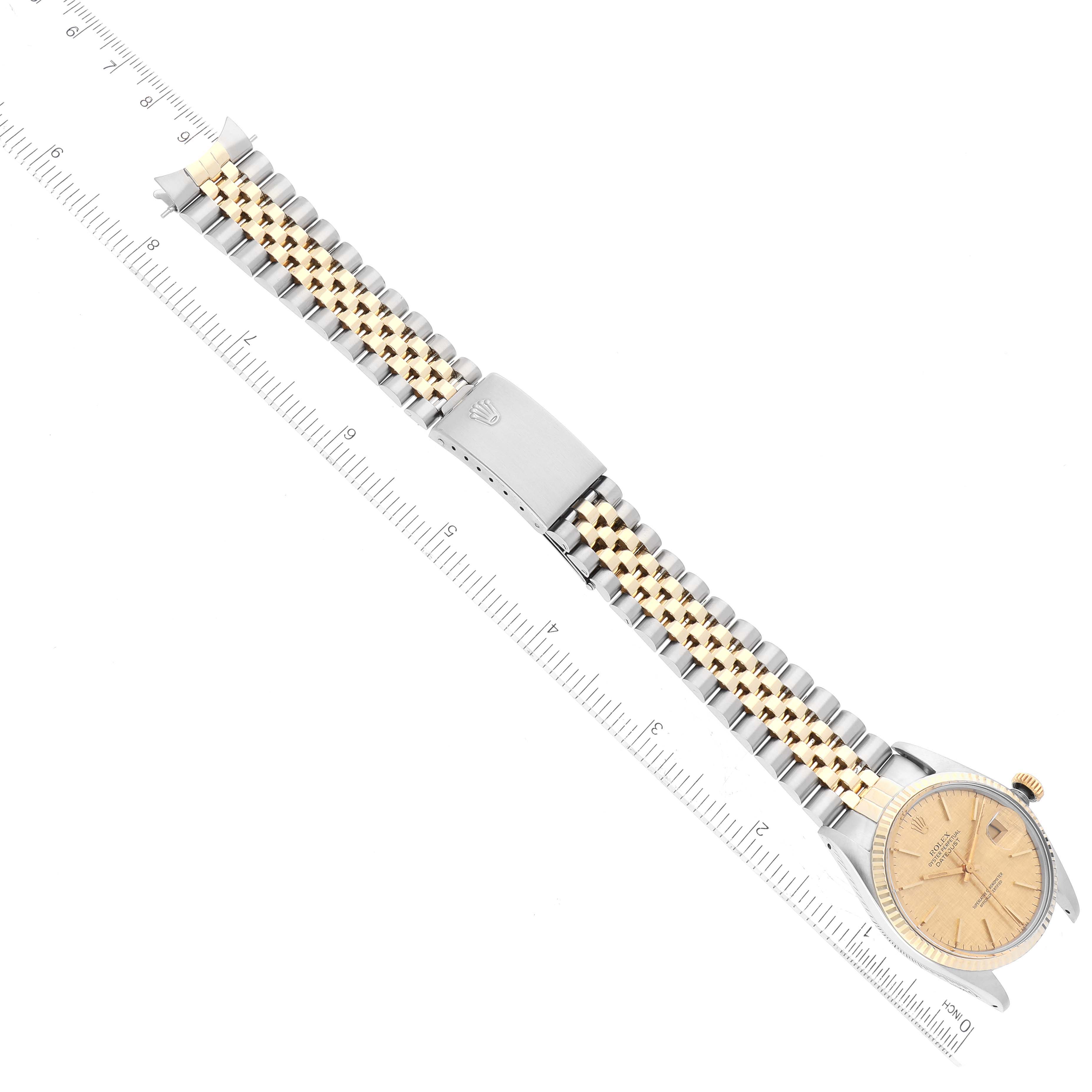 This image shows a flat lay view of the Vintage Collection Rolex watch, highlighting its face, bezel, and band.