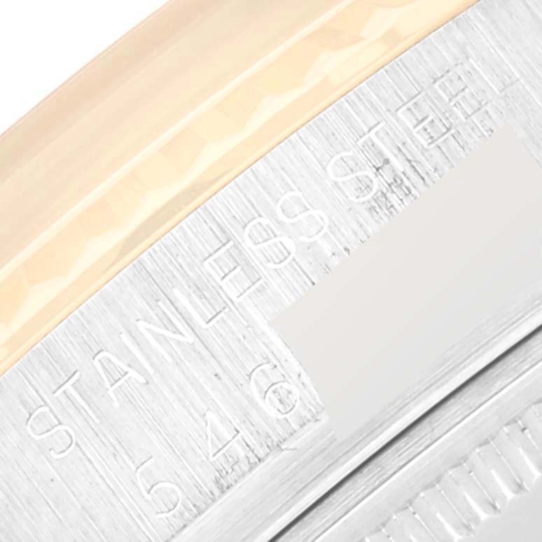 Close-up of the Rolex Vintage Collection 16013 Men's Steel and Gold (two tone) Champagne Dial 16013 Men's Steel and Gold (two tone) Champagne Dial watch case showing the stainless steel text and part of the bezel.