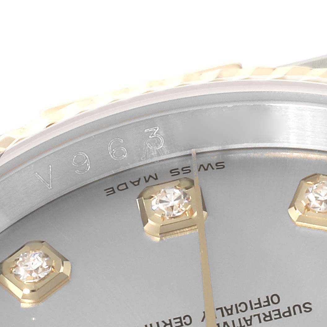 This close-up image shows a portion of the dial, the index markers, and the bezel of a Rolex Datejust 116233 Men's Steel and Gold (two tone) Silver Dial 116233 Men's Steel and Gold (two tone) Silver Dial watch.