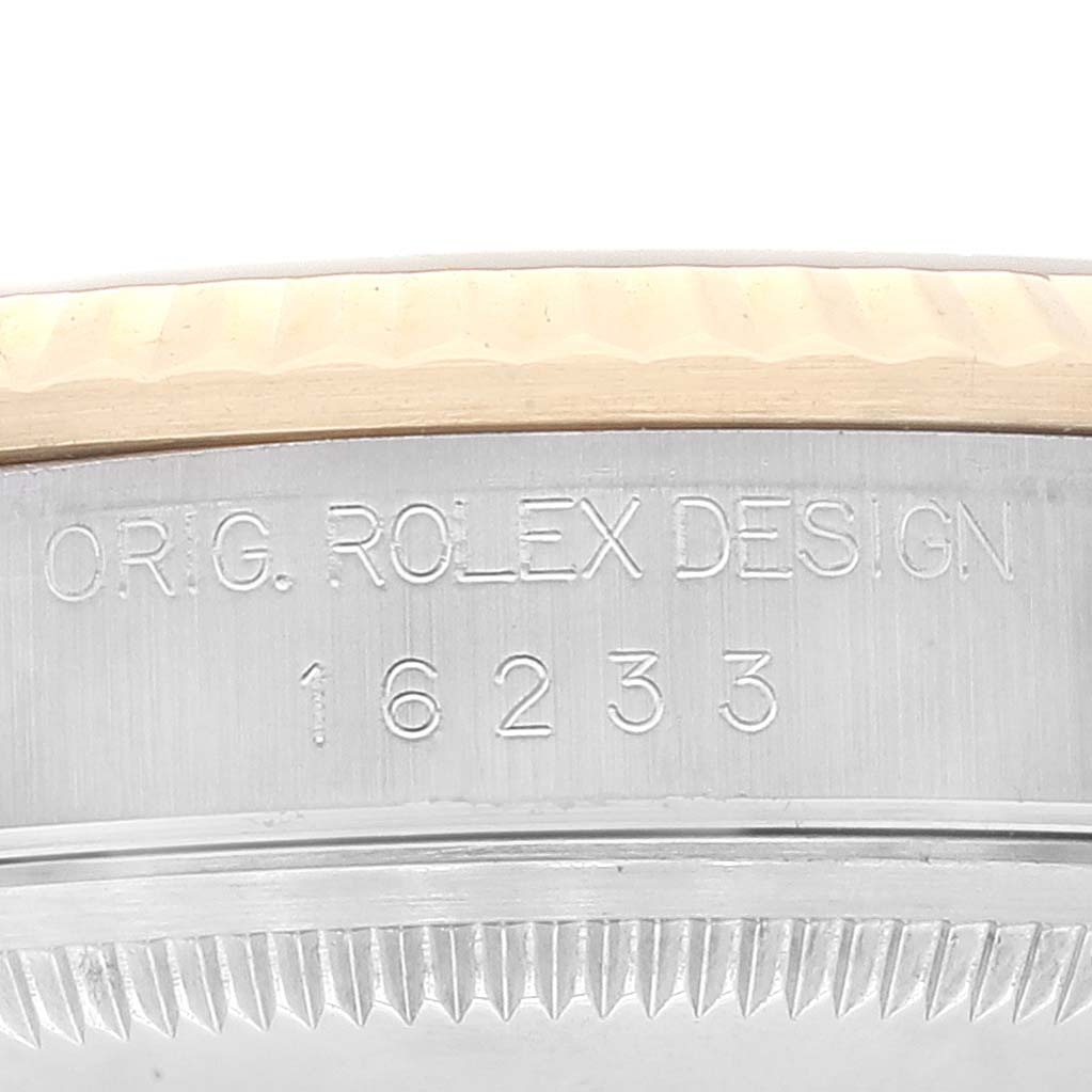 The image shows a close-up of the side of a Rolex Datejust 16233 Men's Steel and Gold (two tone) Grey Dial 16233 Men's Steel and Gold (two tone) Grey Dial, highlighting the "ORIG. ROLEX DESIGN" engraving and model number 16233.