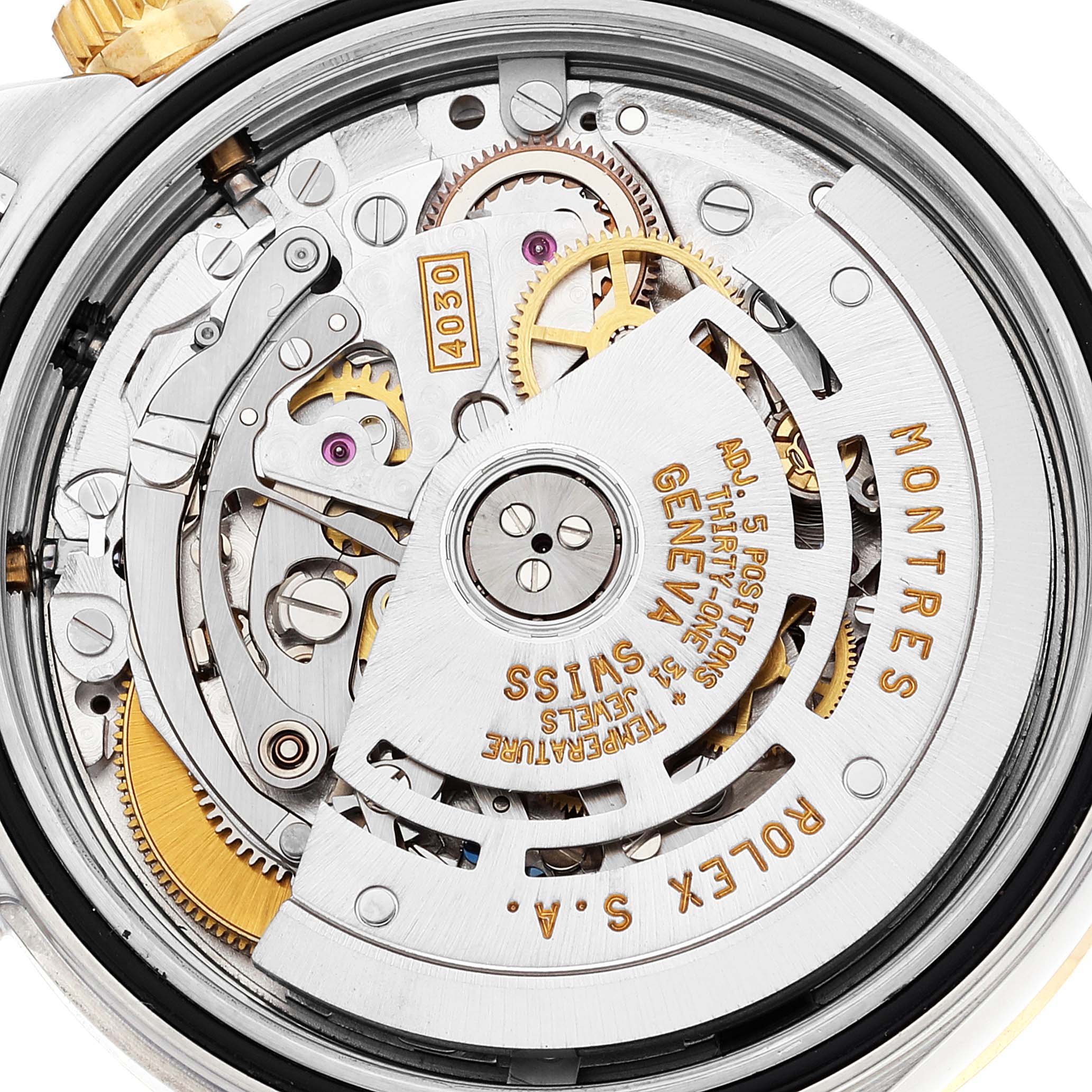 This image shows the intricate movement and internal mechanisms of the Rolex Daytona 16523 Men's Steel and Gold (two tone) White Dial 16523 Men's Steel and Gold (two tone) White Dial watch from a back angle.