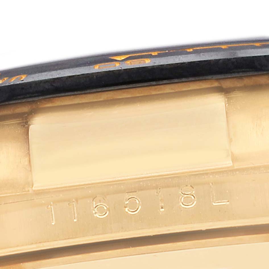 The image shows a partial side view of a Rolex Daytona 116518LNG Men's Yellow Gold Black Dial 116518LNG Men's Yellow Gold Black Dial, focusing on the bezel and engraved model number.