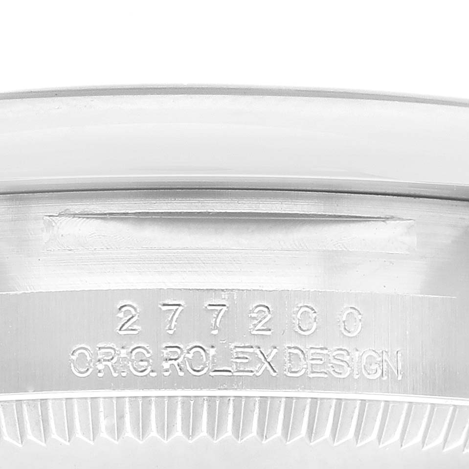 This image shows the side view of the bezel and the serial number of the Rolex Mid-Size 277200 Women's Stainless Steel Yellow Dial 277200 Women's Stainless Steel Yellow Dial model.