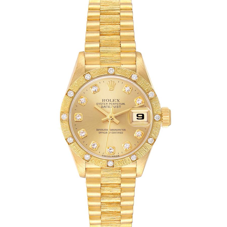 The image shows a frontal view of the Rolex President model watch, highlighting the gold dial, diamond markers, and bracelet.