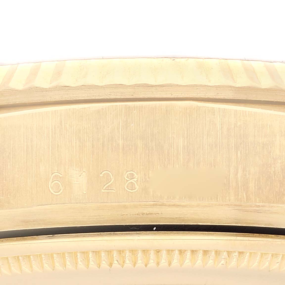 This image shows a close-up of the case side and reference number of a Rolex President 18038 Men's Yellow Gold White Dial 18038 Men's Yellow Gold White Dial model watch.