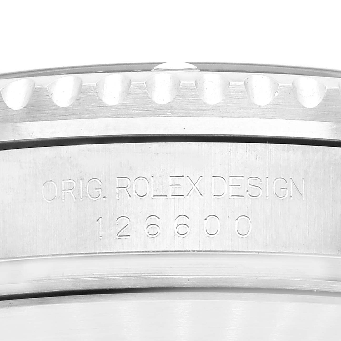 Close-up view of the engraved case side of a Rolex Sea-Dweller 126600 Men's Stainless Steel Black Dial 126600 Men's Stainless Steel Black Dial, showing the serial number 126600 and "O.RIG. ROLEX DESIGN" text.