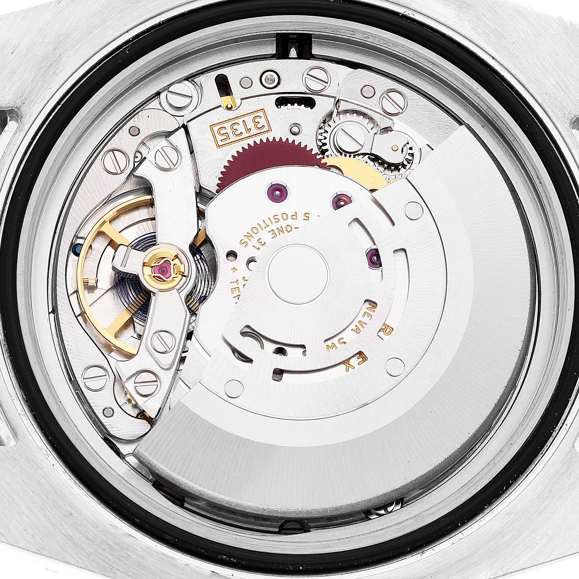 This is a close-up view of the Rolex Submariner 116613 Men's Steel and Gold (two tone) Black Dial 116613 Men's Steel and Gold (two tone) Black Dial's inner mechanism, showcasing its intricate gears and components.