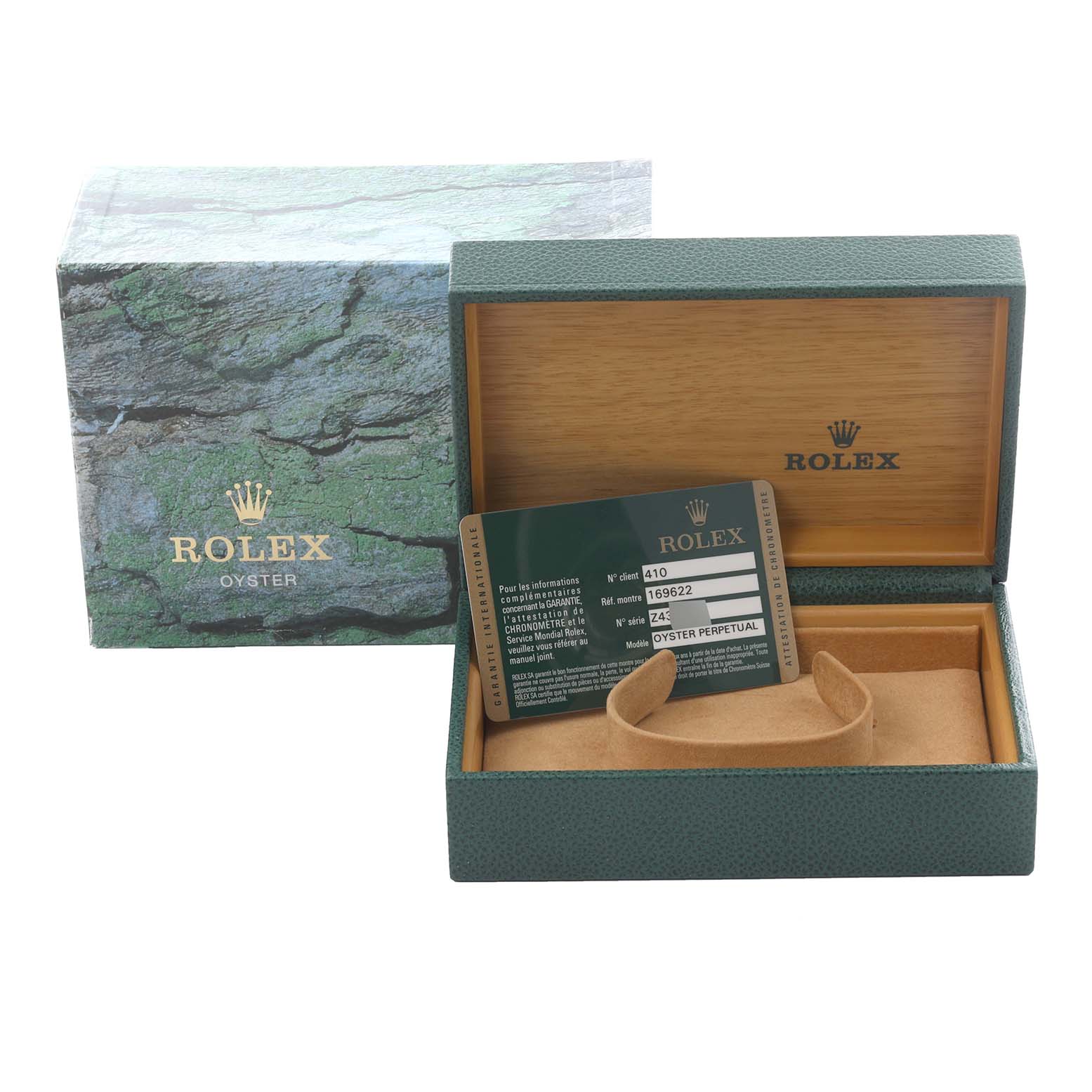 The image shows the case and warranty card for a Rolex Yacht-Master 169622 Women
s Stainless Steel Silver Dial 169622 Women
s Stainless Steel Silver Dial watch from a front angle.
