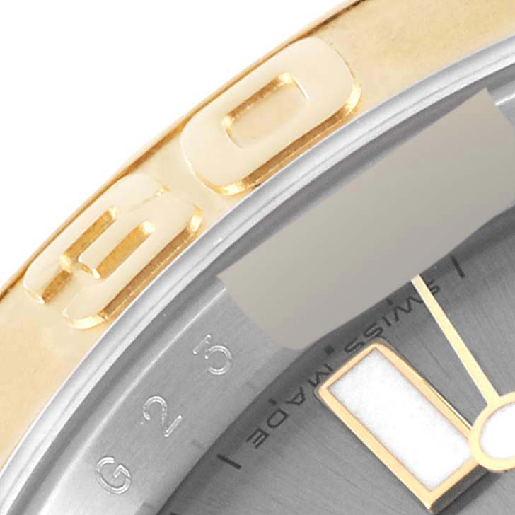 This close-up shows the bezel and part of the dial of a Rolex Yacht-Master 16623 Men's Steel and Gold (two tone) Grey Dial 16623 Men's Steel and Gold (two tone) Grey Dial watch.