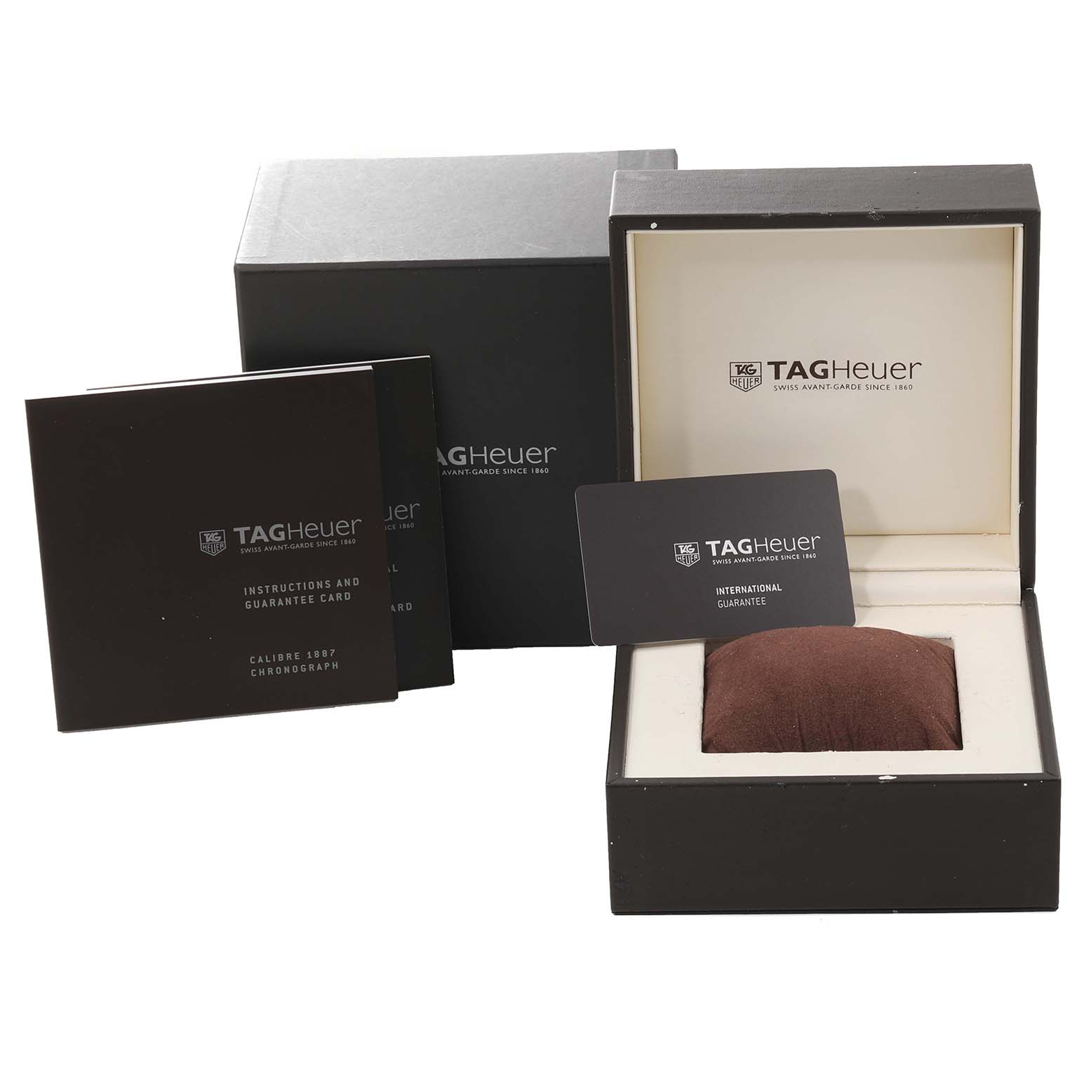 The image shows the packaging, instruction manual, guarantee card, and display box for the Tag Heuer Limited Edition CAR211B Men's Stainless Steel Blue Dial CAR211B Men's Stainless Steel Blue Dial Calibre 1887 Chronograph.