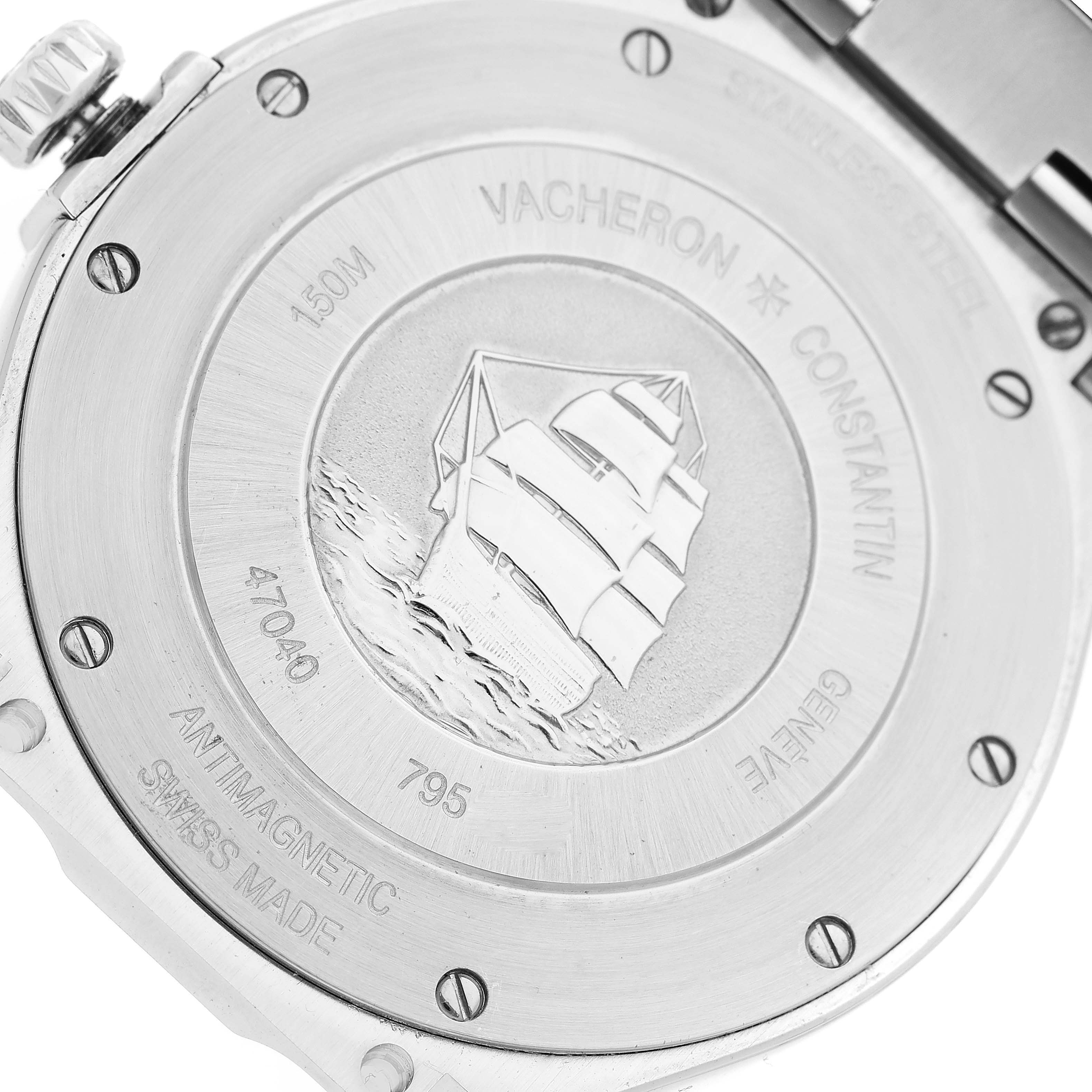 The image shows the case back of a Vacheron Constantin Overseas 47040/B01A-9094 Men's Stainless Steel Black Dial 47040/B01A-9094 Men's Stainless Steel Black Dial watch, featuring an engraved ship and various inscriptions.