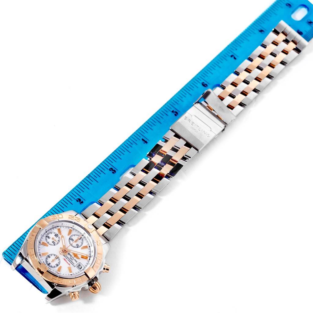 The image shows a full view of the Breitling C13358 Steel and Gold (two tone) Mother of Pearl Dial C13358 Steel and Gold (two tone) Mother of Pearl Dial Chrono Galactic Stainless Steel Rose Gold Watch C13358, including the dial and bracelet next to a ruler.