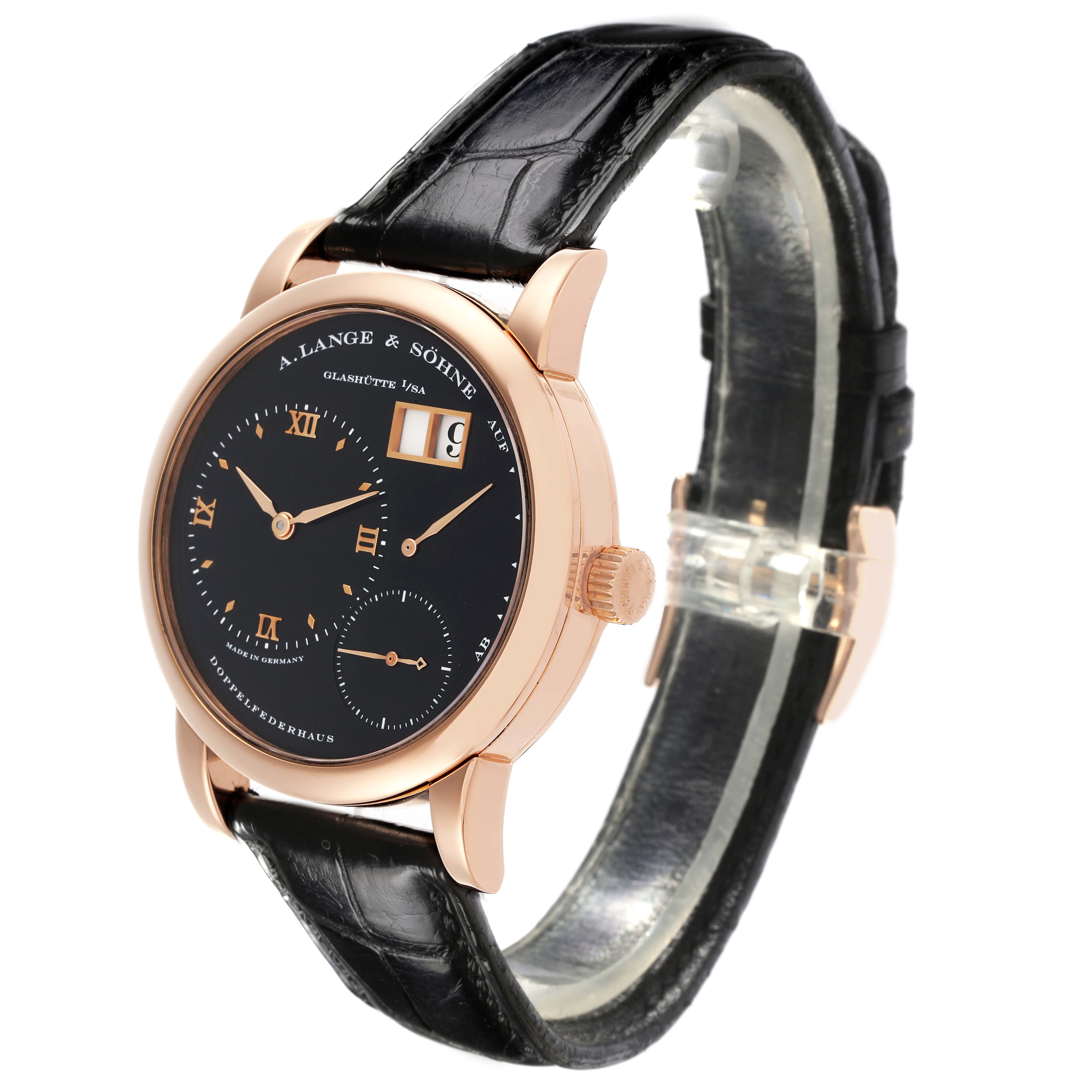 The Lange 1 watch by A. Lange 
Söhne is shown at a slight angle, highlighting the black dial, gold case, and leather strap.